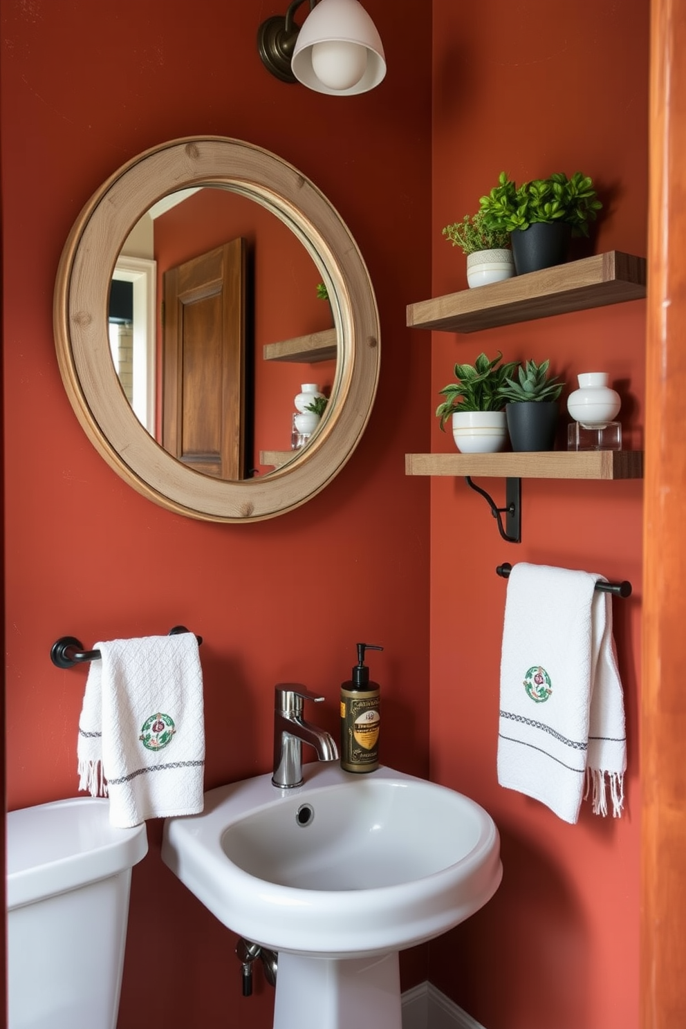 A cozy powder room featuring earthy terracotta walls that evoke a warm and rustic ambiance. The space is accented with natural wood elements and soft lighting to enhance the inviting atmosphere. A round mirror with a distressed wooden frame hangs above a sleek pedestal sink. Decorative shelves showcase potted plants and artisanal hand towels, adding a personal touch to the design.