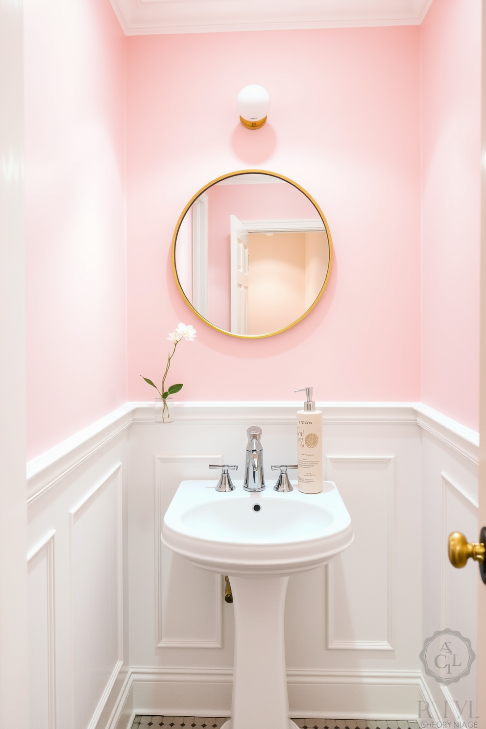 A pastel pink powder room features soft lighting that creates a warm and inviting atmosphere. The walls are painted in a delicate pastel pink hue, complemented by white wainscoting for a touch of elegance. A round mirror with a gold frame hangs above a sleek white pedestal sink. Decorative elements include a small potted plant and a chic soap dispenser, enhancing the playful yet sophisticated vibe of the space.