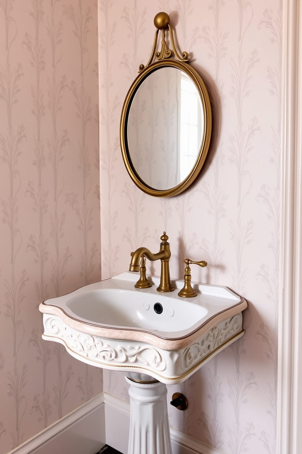 A stylish powder room featuring a vintage sink with intricate detailing. The sink is paired with a polished brass faucet that adds a touch of elegance to the space. The walls are adorned with soft pastel wallpaper that complements the sink. A small round mirror with a brass frame hangs above the sink, enhancing the vintage charm.