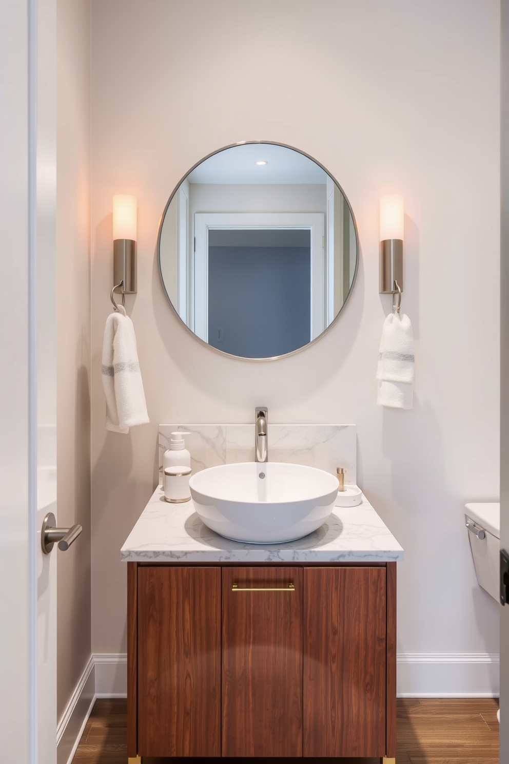 A stylish powder room features a sleek vanity with a round mirror elegantly positioned above it. The vanity is crafted from rich wood, complemented by a polished marble countertop that adds a touch of luxury.