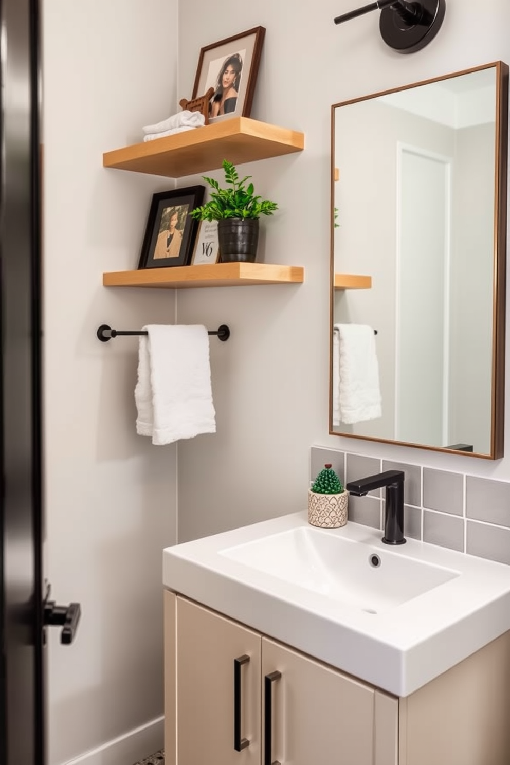 A chic powder room featuring a sleek vanity with a stylish sink. Above the vanity, floating shelves display curated decor items and a small potted plant for a touch of greenery.