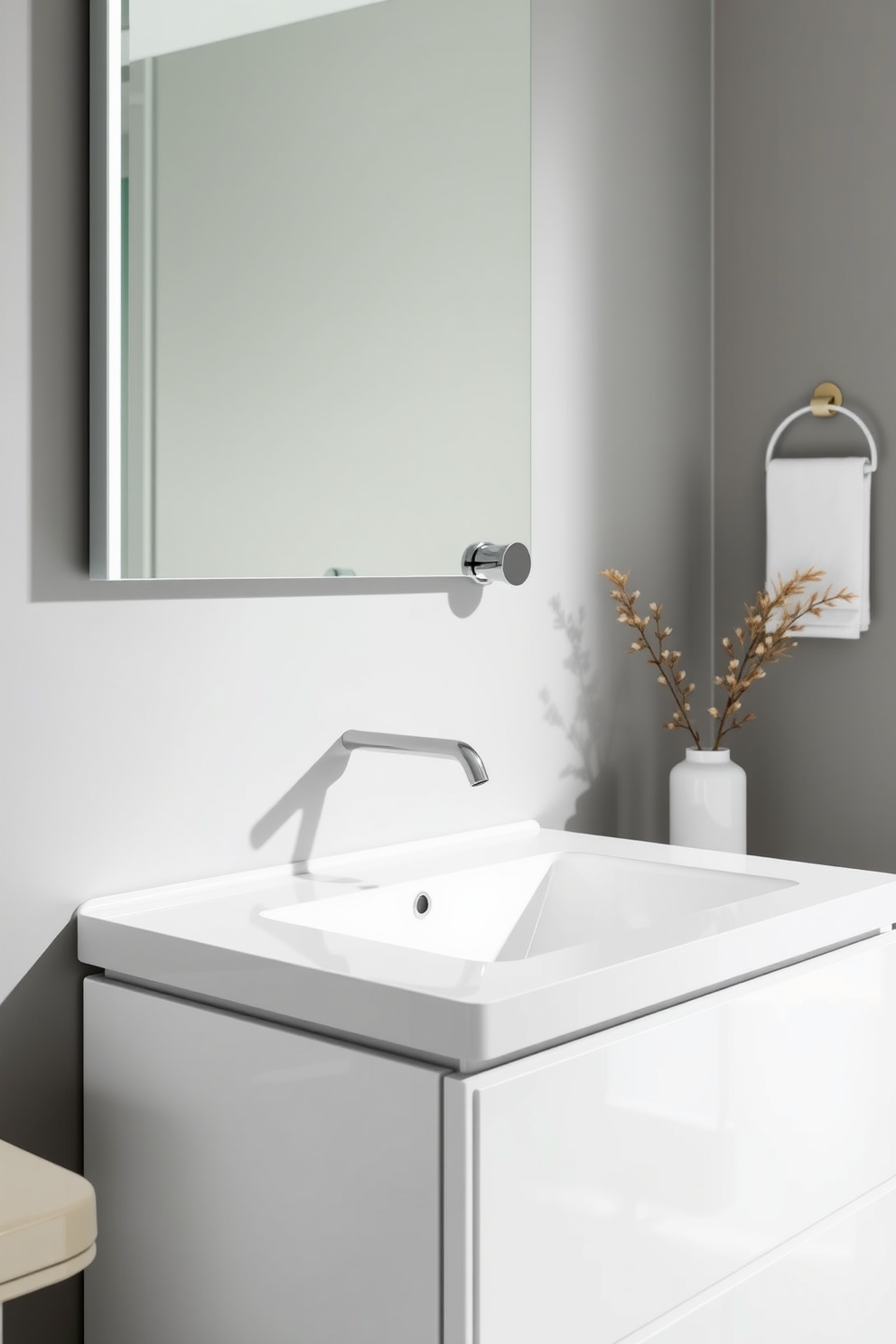 A sleek powder room featuring an elegant wall-mounted faucet that enhances the modern aesthetic. The vanity showcases a minimalist design with clean lines and a glossy finish, complemented by a stylish mirror above it.