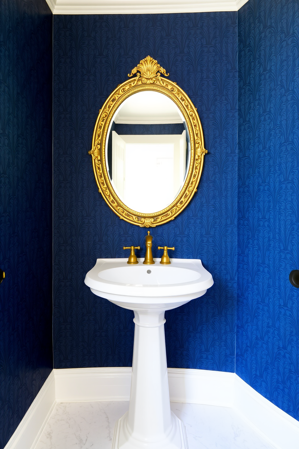 Textured wallpaper in a rich deep blue hue creates a dramatic backdrop for the powder room. The elegant design features intricate patterns that add depth and sophistication to the space. A sleek white pedestal sink is centered against the wallpaper, complemented by a vintage-style gold faucet. Above the sink, a round mirror with a decorative gold frame enhances the luxurious feel of the room.