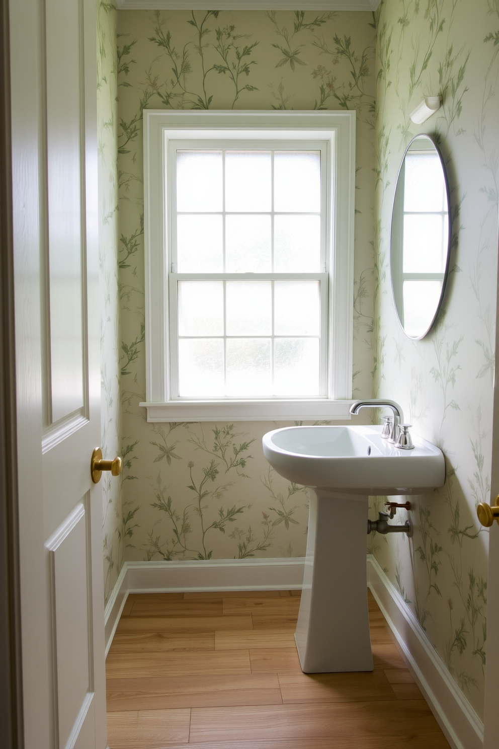 Nature inspired prints adorn the walls of a serene retreat powder room creating a calming atmosphere. The wallpaper features delicate botanical patterns in soft greens and muted earth tones, enhancing the natural light streaming through a frosted glass window. A sleek pedestal sink complements the design, with a polished chrome faucet adding a modern touch. The floor is covered in light wood planks, providing warmth and continuity to the tranquil space.