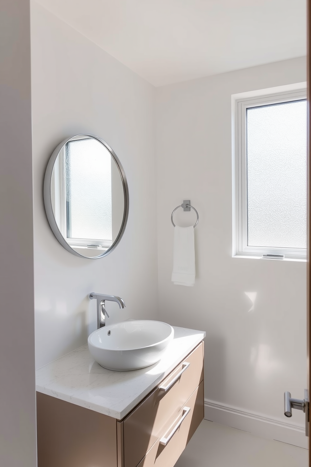 A bright and airy quarter bathroom featuring sleek fixtures and modern design elements. The space is enhanced by natural light streaming through a frosted glass window, creating a welcoming atmosphere. The walls are painted in a soft white hue, complemented by a stylish floating vanity with a quartz countertop. A round mirror with a polished chrome frame hangs above the sink, reflecting the light and adding depth to the room.