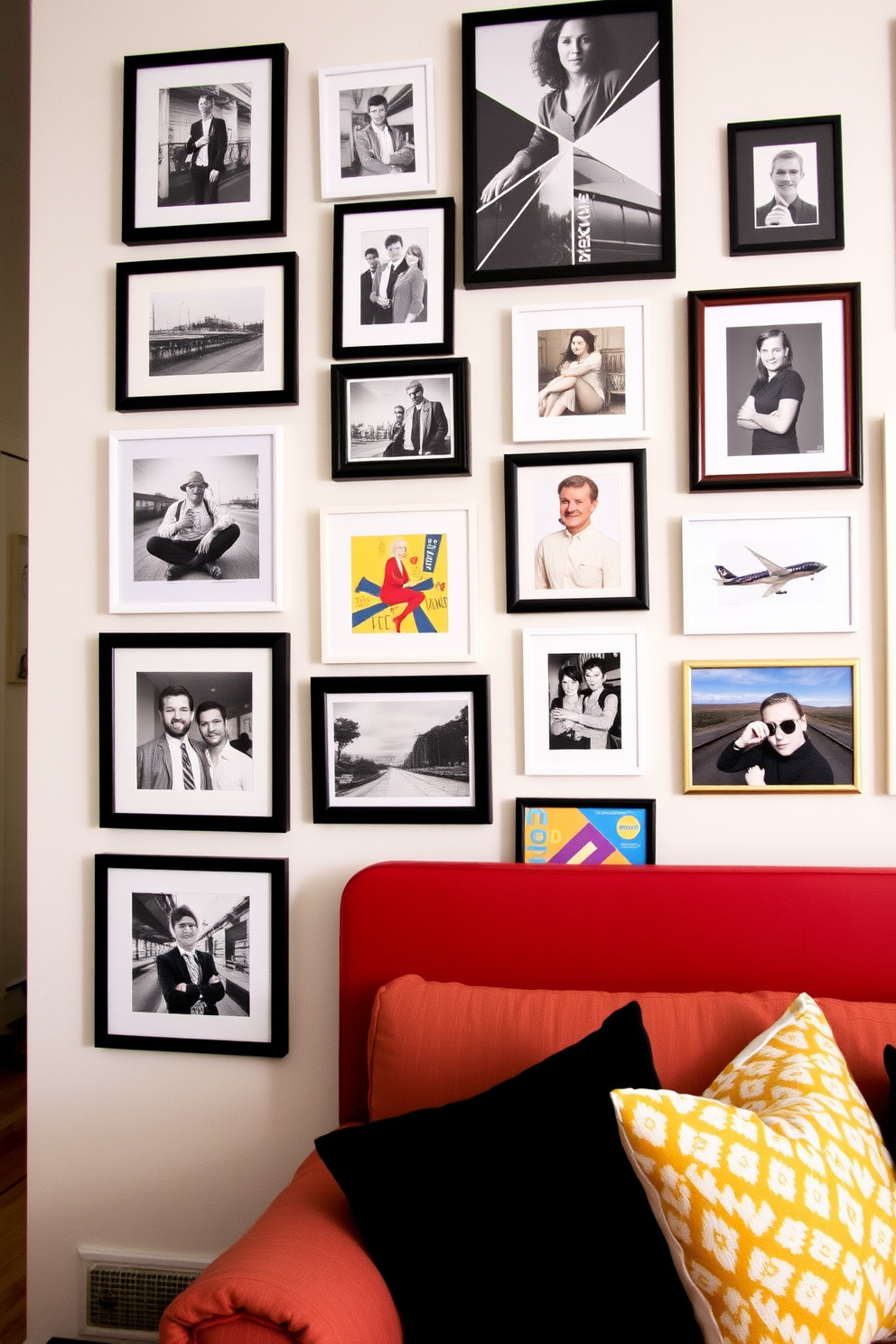 A stylish gallery wall featuring a mix of framed photographs and artwork in various sizes. The arrangement includes black and white images alongside colorful pieces, creating a vibrant yet cohesive look in the Railroad Apartment.