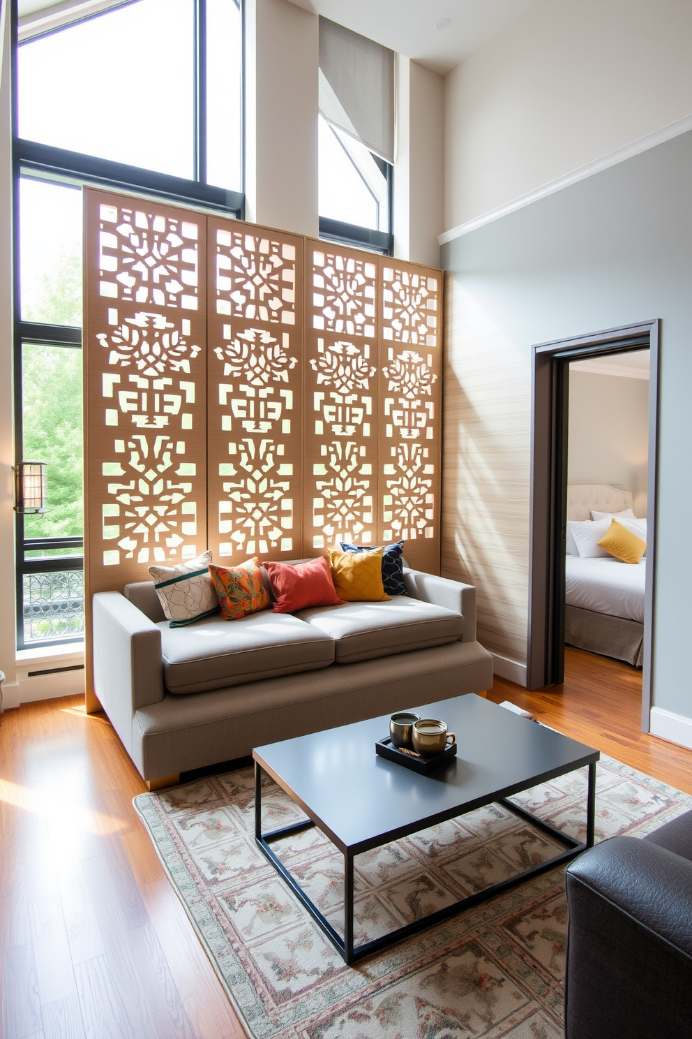 A stylish railroad apartment layout featuring a modern room divider that enhances privacy while maintaining an open feel. The divider is made of light wood with intricate cut-out patterns and separates the living area from the bedroom space, adding a touch of elegance. The living area showcases a cozy sofa adorned with colorful throw pillows and a sleek coffee table in front. Large windows allow natural light to flood the space, highlighting the warm tones of the hardwood floor and the soft textures of the furnishings.