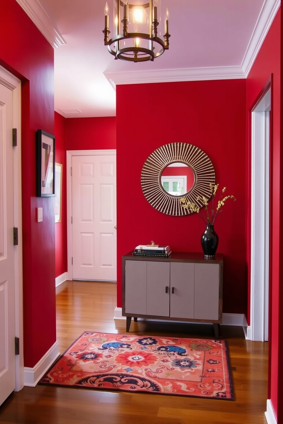 A welcoming entryway featuring warm red walls that create an inviting atmosphere. The space includes a stylish console table with a decorative mirror above it, complemented by a vibrant area rug that adds texture and comfort.