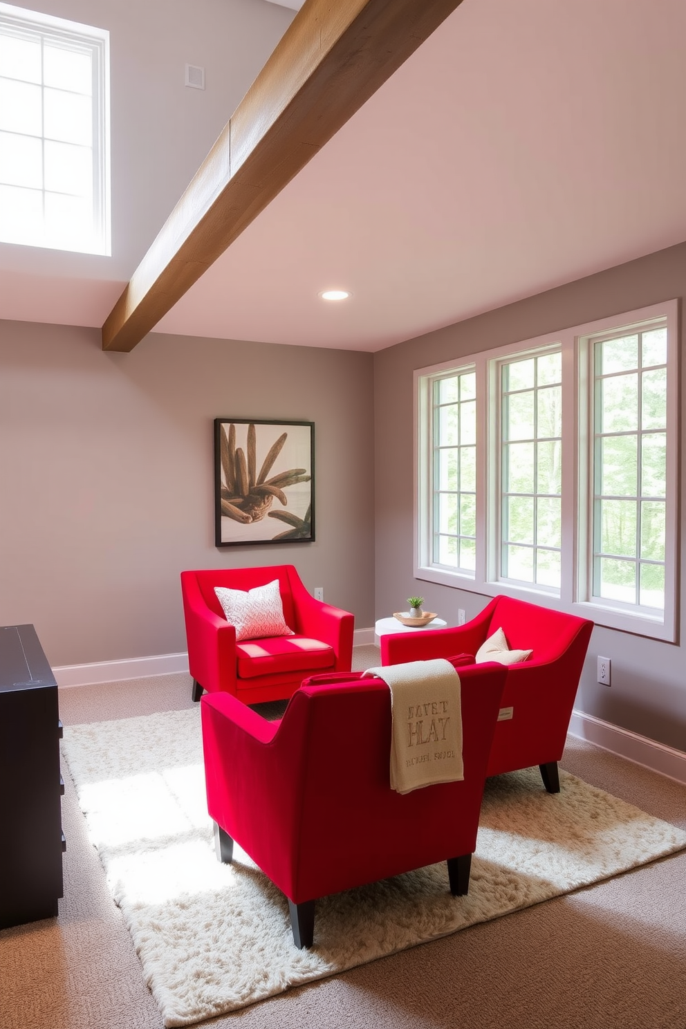 Bright red accent chairs provide a striking contrast against the neutral tones of the basement. The space features a cozy seating area with a plush area rug and soft lighting to create an inviting atmosphere. The walls are painted in a soft gray, while the ceiling showcases exposed beams for a modern industrial feel. Large windows allow natural light to flood in, enhancing the vibrant red of the chairs and creating a lively focal point in the room.