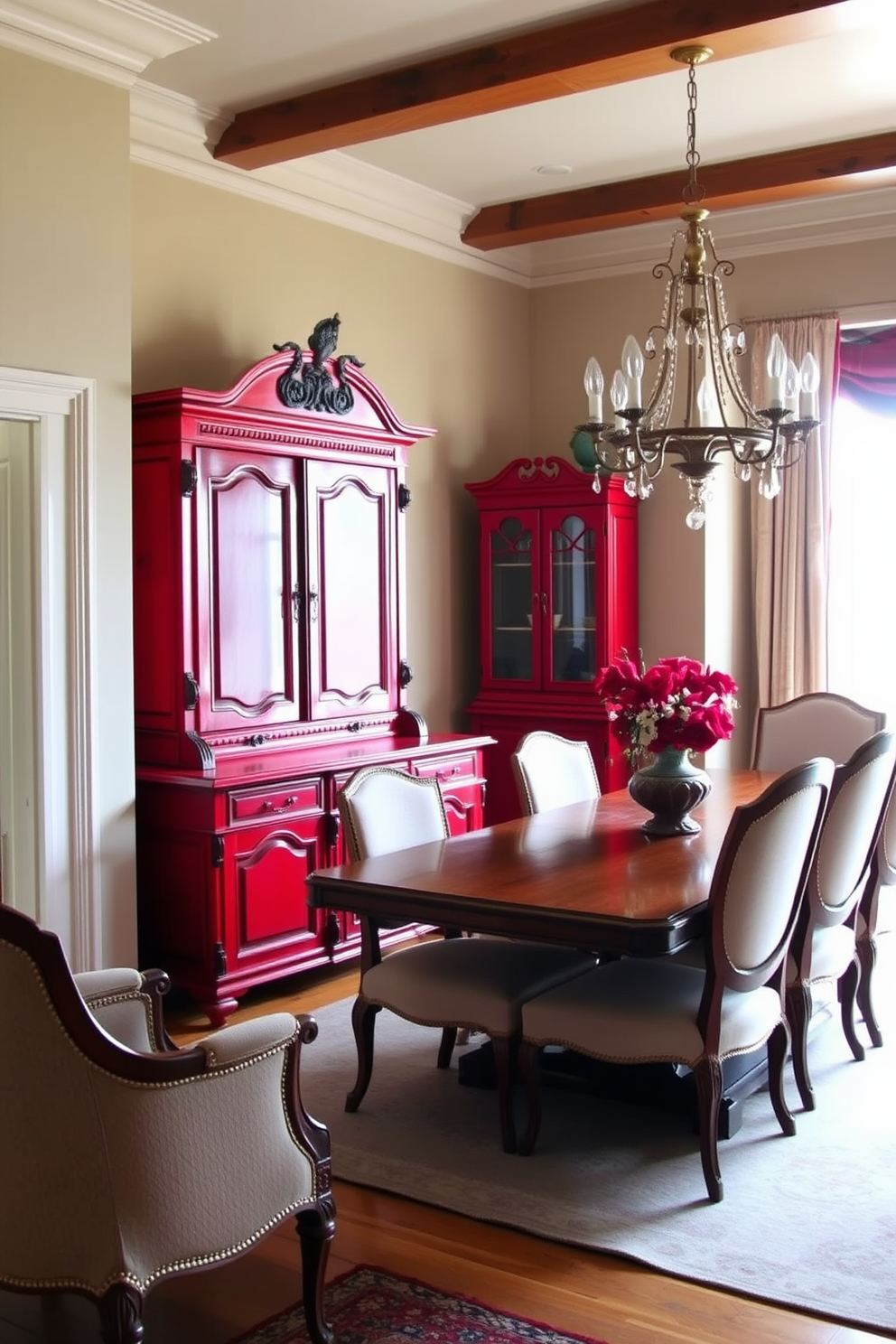 A vintage red sideboard stands against the wall, providing ample storage space while adding a pop of color to the room. The sideboard features intricate carvings and antique brass hardware, enhancing its classic appeal. The dining room is designed with a warm and inviting atmosphere, showcasing a large wooden table surrounded by elegant upholstered chairs. Soft lighting from a vintage chandelier casts a cozy glow, complementing the rich red accents throughout the space.