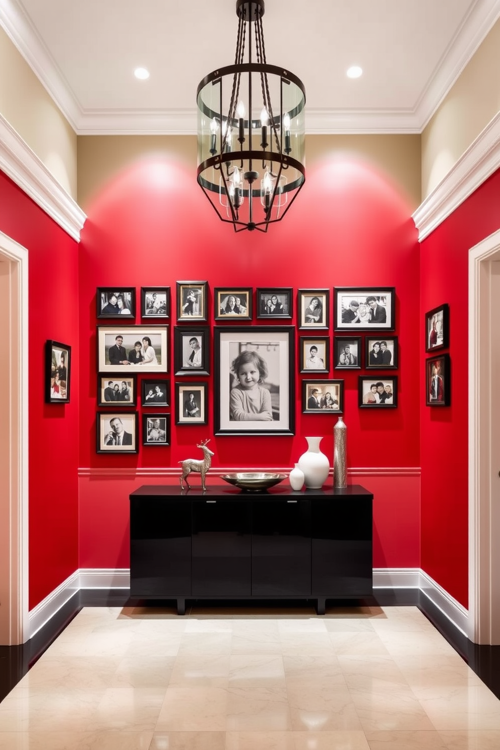 A striking foyer with a bold red accent wall that serves as a vibrant backdrop for an array of framed photos showcasing cherished memories. The space is illuminated by a stylish chandelier, and a sleek console table with decorative items adds elegance to the entrance.