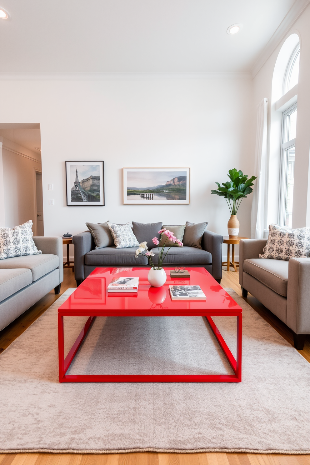 A vibrant red coffee table serves as the focal point in a contemporary living room. The surrounding furniture features neutral tones, with a plush gray sofa and soft beige armchairs, creating a balanced and inviting atmosphere. The walls are painted in a soft white, enhancing the brightness of the space. A large area rug in muted tones anchors the seating arrangement while complementing the boldness of the red coffee table.