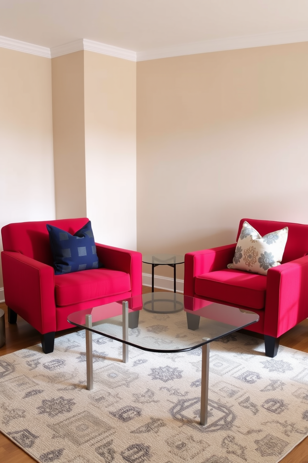 A stylish living room features two red upholstered chairs positioned around a sleek glass coffee table. The walls are painted in a soft neutral tone, creating a warm and inviting atmosphere. A contemporary area rug lies beneath the chairs, adding texture and comfort to the space. Decorative throw pillows in complementary colors enhance the seating arrangement, making it perfect for relaxation and conversation.