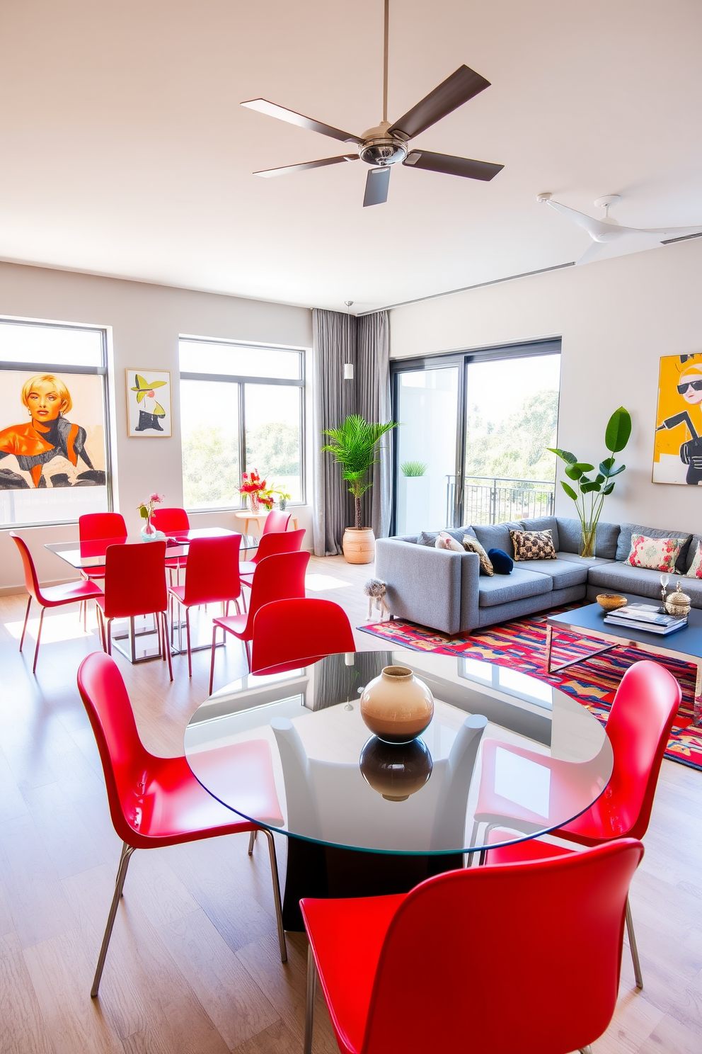 A vibrant open living space features a stylish red dining set with sleek red chairs surrounding a modern glass table. The walls are adorned with contemporary art, and large windows allow natural light to flood the room, enhancing the bold color scheme. The living area includes a plush gray sofa and a chic coffee table, creating a cozy yet elegant atmosphere. Decorative elements such as a colorful area rug and potted plants add warmth and character to the design.