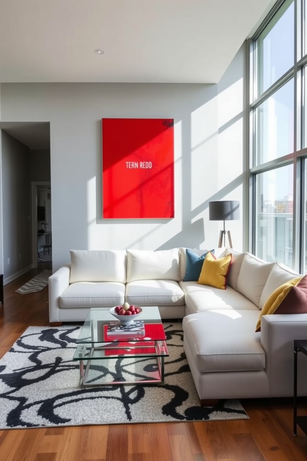 A bright red artwork serves as the focal point in a modern living room. The space features a plush white sectional sofa, complemented by a sleek glass coffee table and a stylish area rug that ties the colors together. The walls are painted in a soft gray tone to enhance the vibrancy of the artwork. Large windows allow natural light to flood the room, creating an inviting atmosphere perfect for relaxation and entertaining.