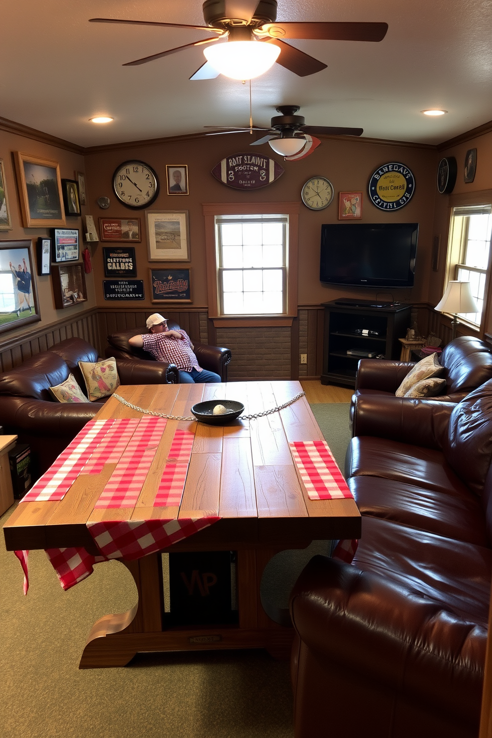 A cozy man cave featuring a rustic wooden table covered with a red and white checkered tablecloth. The walls are adorned with vintage sports memorabilia and a large flat-screen TV is mounted for game days. Comfortable leather sofas are arranged around a coffee table, inviting relaxation and conversation. Soft lighting creates a warm ambiance, making it the perfect spot for entertaining friends.