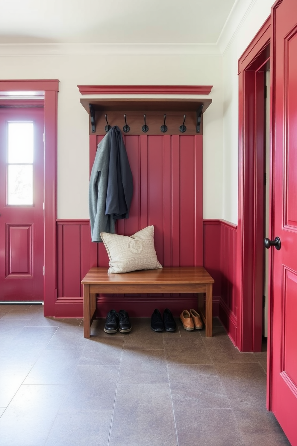 A red accent chair is positioned in a cozy corner, inviting relaxation with its plush cushions and soft fabric. A small side table accompanies the chair, topped with a stack of books and a warm throw blanket draped over the arm. The mudroom features a functional design with built-in benches and hooks for easy organization. Bright red accents add a pop of color, while durable flooring ensures practicality and style.