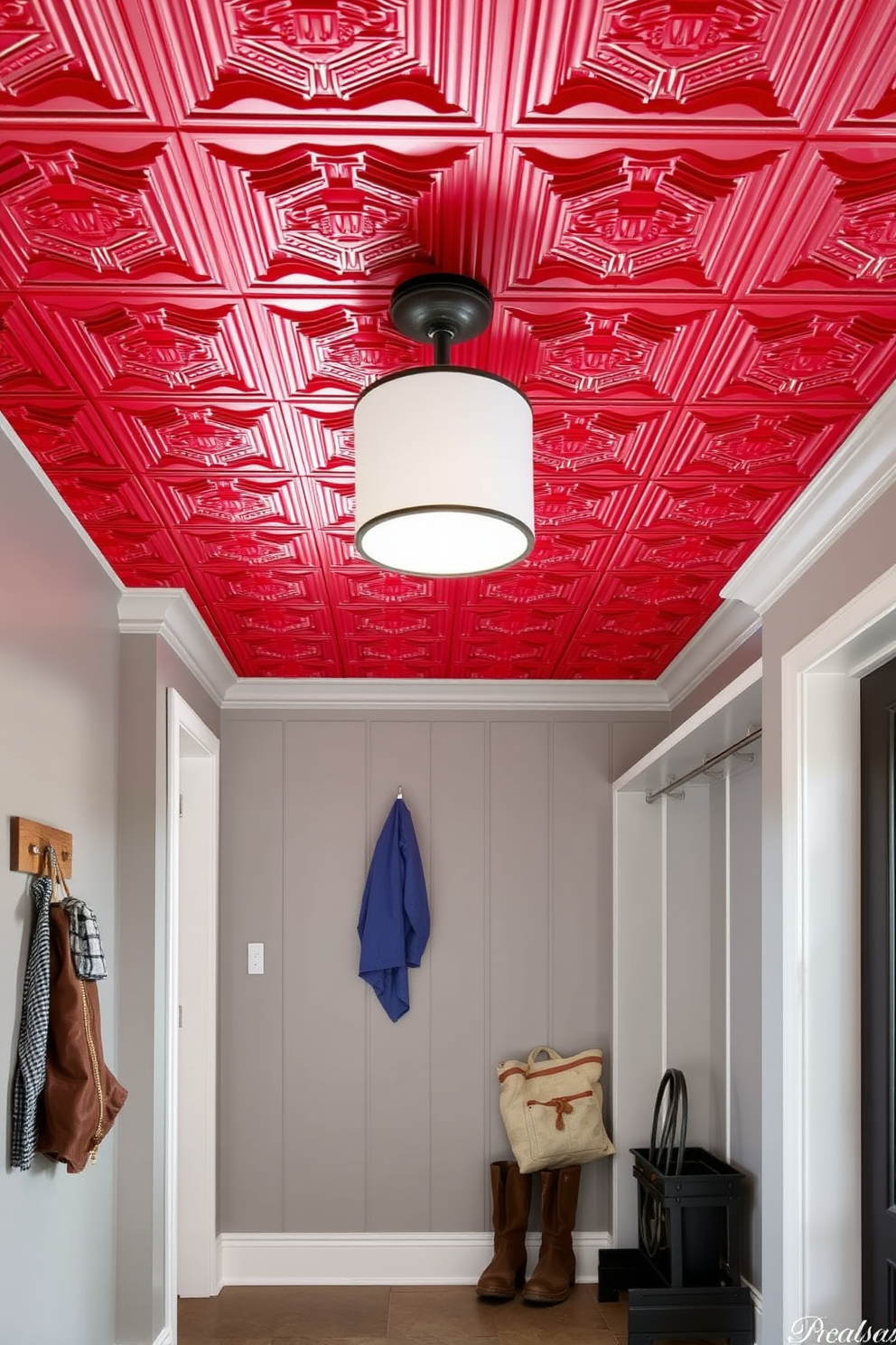 A bold red ceiling creates a dramatic focal point in the mudroom, enhancing the overall aesthetic. The walls are painted in a soft neutral tone to balance the intensity of the ceiling. The space features custom-built storage benches with hooks above for coats and bags. A stylish area rug adds warmth and texture to the floor, complementing the vibrant ceiling.