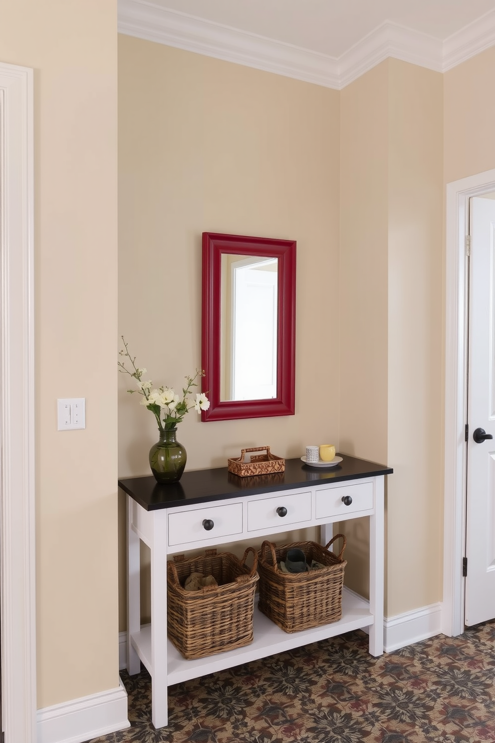 A stylish mudroom featuring a mix of red and gray color scheme. The walls are painted in a soft gray, while red accents are introduced through the furniture and decor. There are built-in wooden benches with red cushions and hooks for coats above. The floor is covered with a durable gray tile that complements the overall color palette.