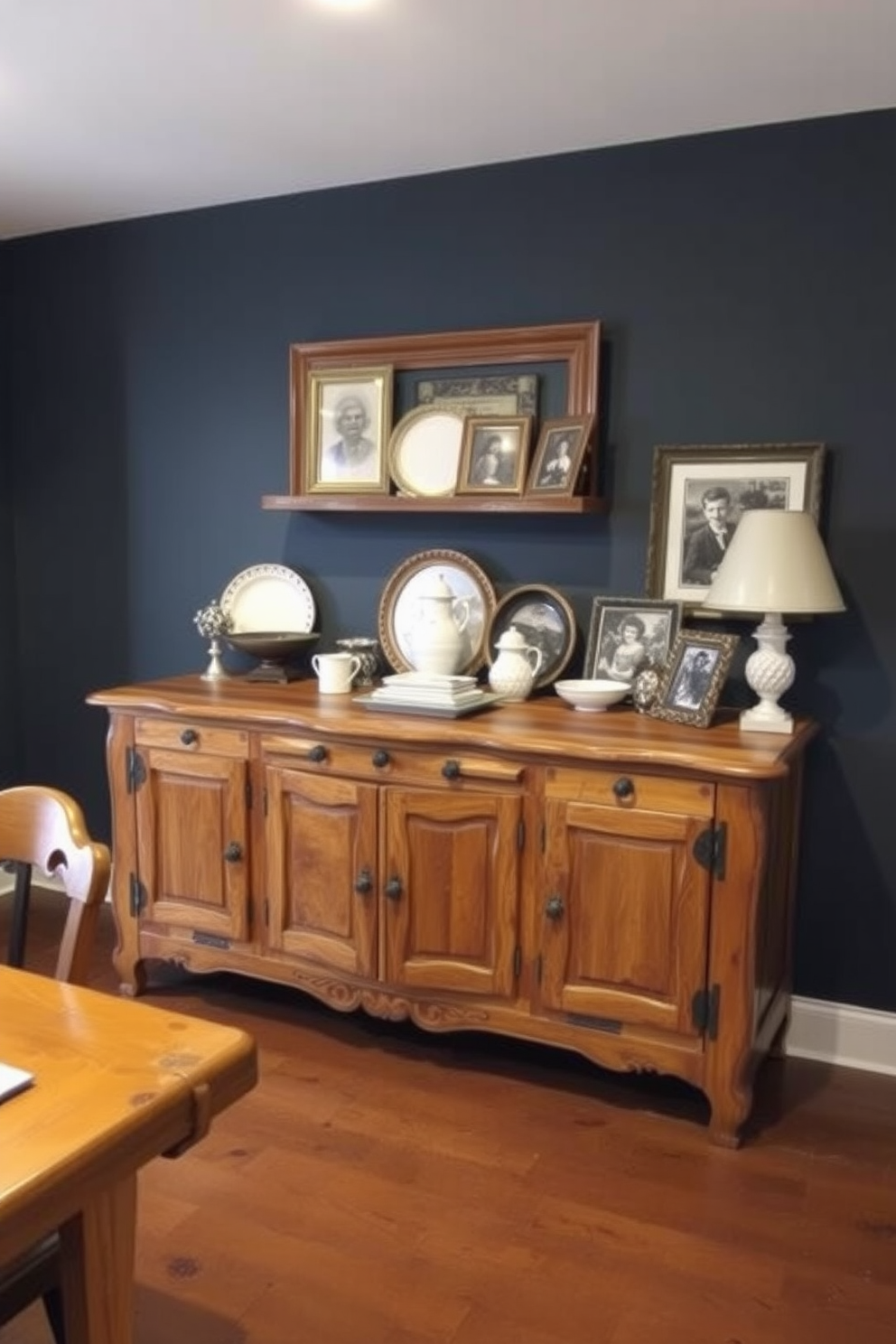 A rustic dining room features an antique sideboard crafted from reclaimed wood, showcasing intricate carvings and a warm finish. The sideboard is adorned with vintage tableware and a collection of framed family photos, enhancing the room's charm and character.