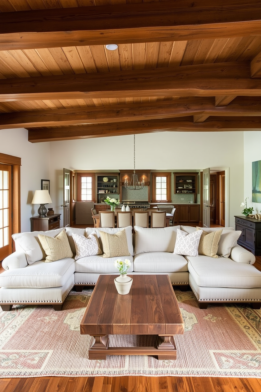 A cozy family room features a vintage trunk serving as a unique coffee table. Surrounding the trunk are plush, oversized sofas adorned with warm-toned cushions and a woven area rug underfoot. The walls are decorated with family photos in rustic frames, creating a personal touch. A stone fireplace adds warmth to the space, complemented by wooden beams across the ceiling.