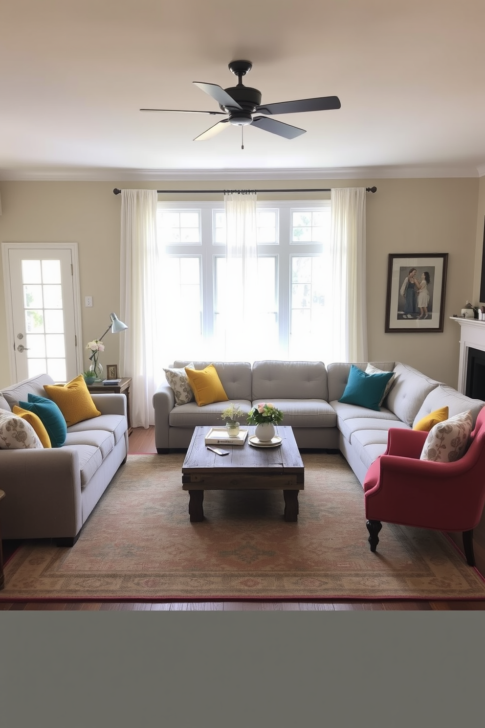 A cozy family room featuring a neutral palette with soft beige walls and a light gray sectional sofa. Brightly colored throw pillows in shades of teal and mustard add a cheerful touch, while a reclaimed wood coffee table anchors the space. A large area rug in muted tones defines the seating area, complemented by a pair of vintage armchairs in a bold coral hue. Natural light floods the room through large windows adorned with sheer white curtains, creating an inviting atmosphere.