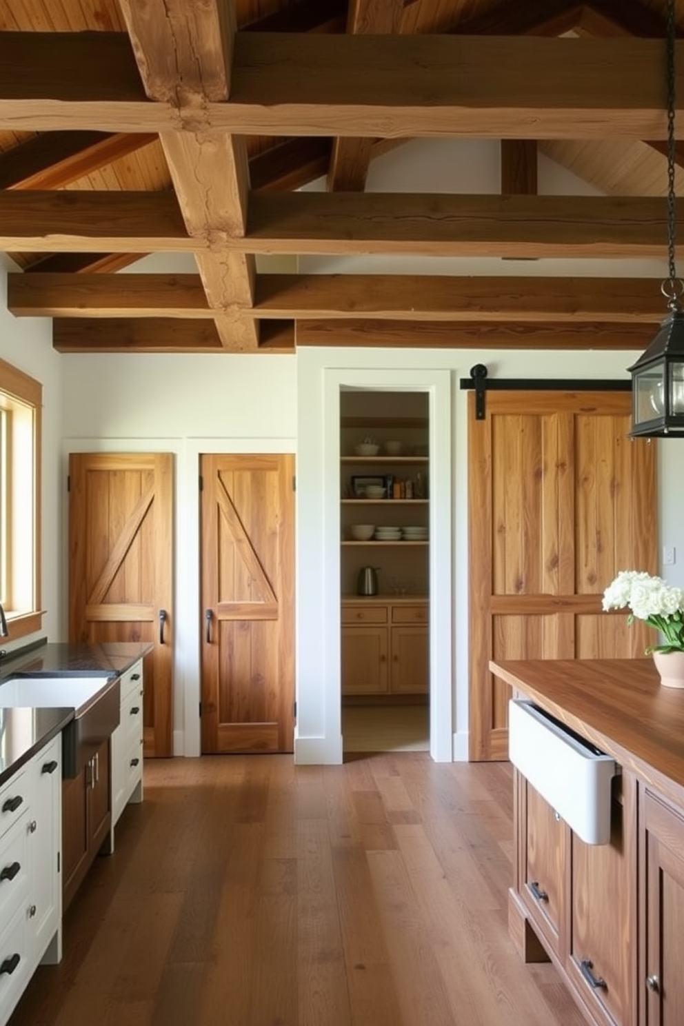 A rustic kitchen featuring barn doors as pantry and closet doors. The kitchen has exposed wooden beams, a large farmhouse sink, and a central island with a butcher block countertop.