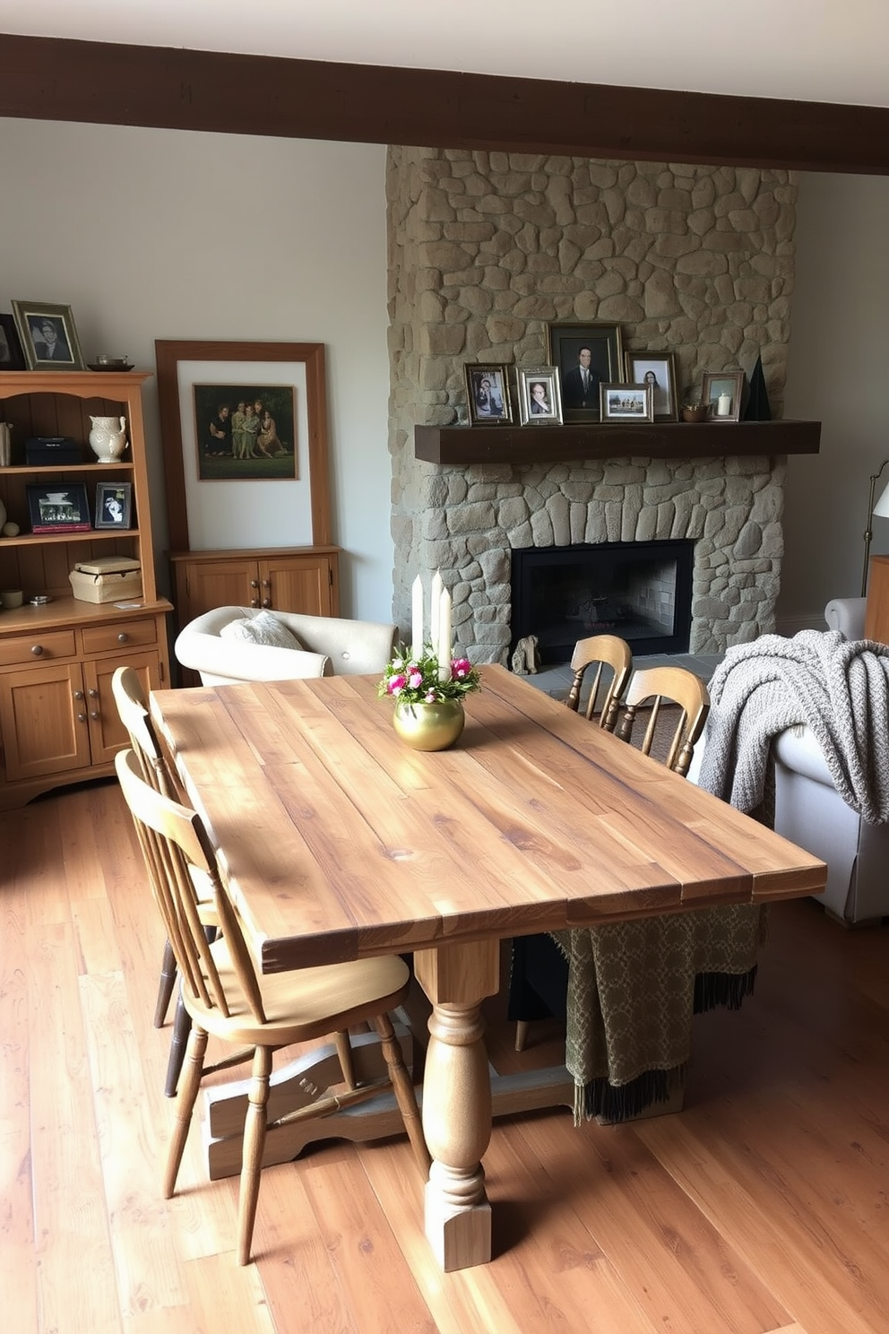 A rustic dining table made of reclaimed wood sits in the center of a cozy living area. Surrounding the table are mismatched chairs upholstered in warm, earthy tones that invite family gatherings. The living room features a stone fireplace as the focal point, with a wooden mantel adorned with candles and family photos. Soft, textured throw blankets are draped over a large, comfortable sofa, creating an inviting atmosphere.