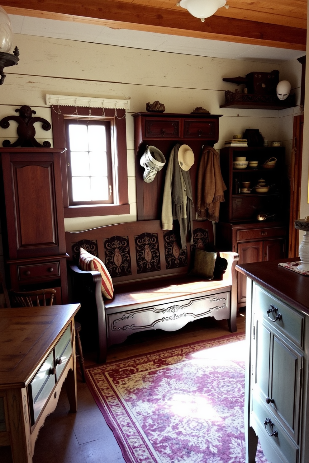 Antique furniture pieces are arranged throughout the rustic mudroom, creating a warm and inviting atmosphere. A large wooden bench with intricate carvings sits against the wall, complemented by vintage hooks for hanging coats and hats. The floor is covered with a durable yet stylish patterned rug, adding texture to the space. Natural light floods in through a small window, illuminating the charming details of the antique decor.