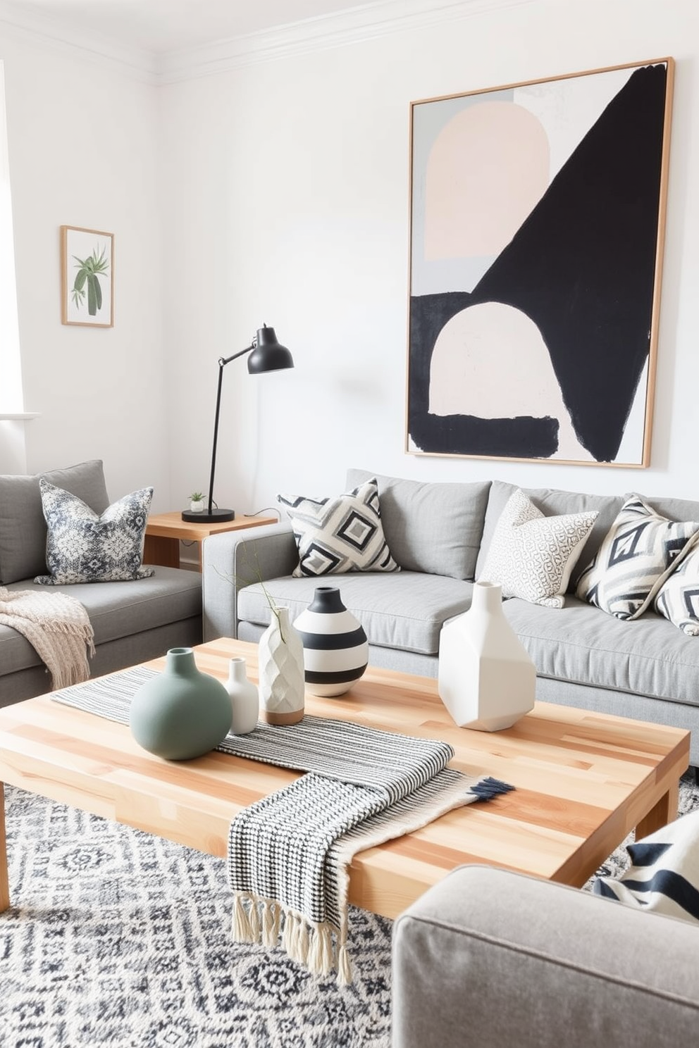 A Scandinavian living room featuring geometric patterns in decor. The space includes a light wood coffee table adorned with a striped textile runner and a collection of modern ceramic vases. The walls are painted in a soft white, complemented by a large abstract artwork with bold geometric shapes. Cozy furnishings, such as a plush gray sofa and a patterned area rug, create an inviting atmosphere.