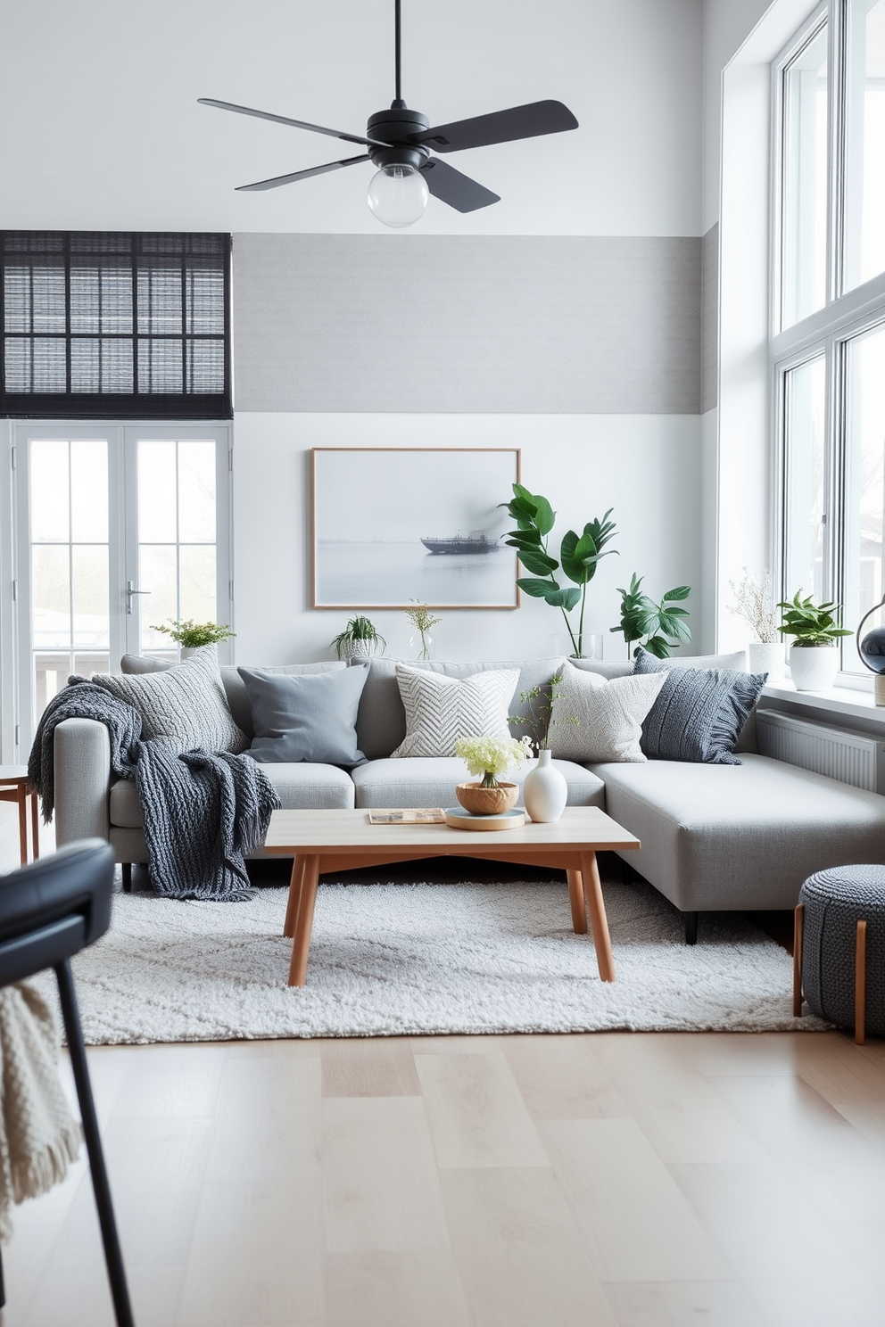 A cozy Scandinavian living room features a plush sofa adorned with textured cushions in various shades of gray and cream. A light wood coffee table sits in front, surrounded by a soft area rug that adds warmth to the space. Large windows allow natural light to flood the room, highlighting the minimalist decor and greenery placed strategically around. The walls are painted in a soft white, creating an inviting atmosphere that emphasizes the simplicity and functionality of Scandinavian design.