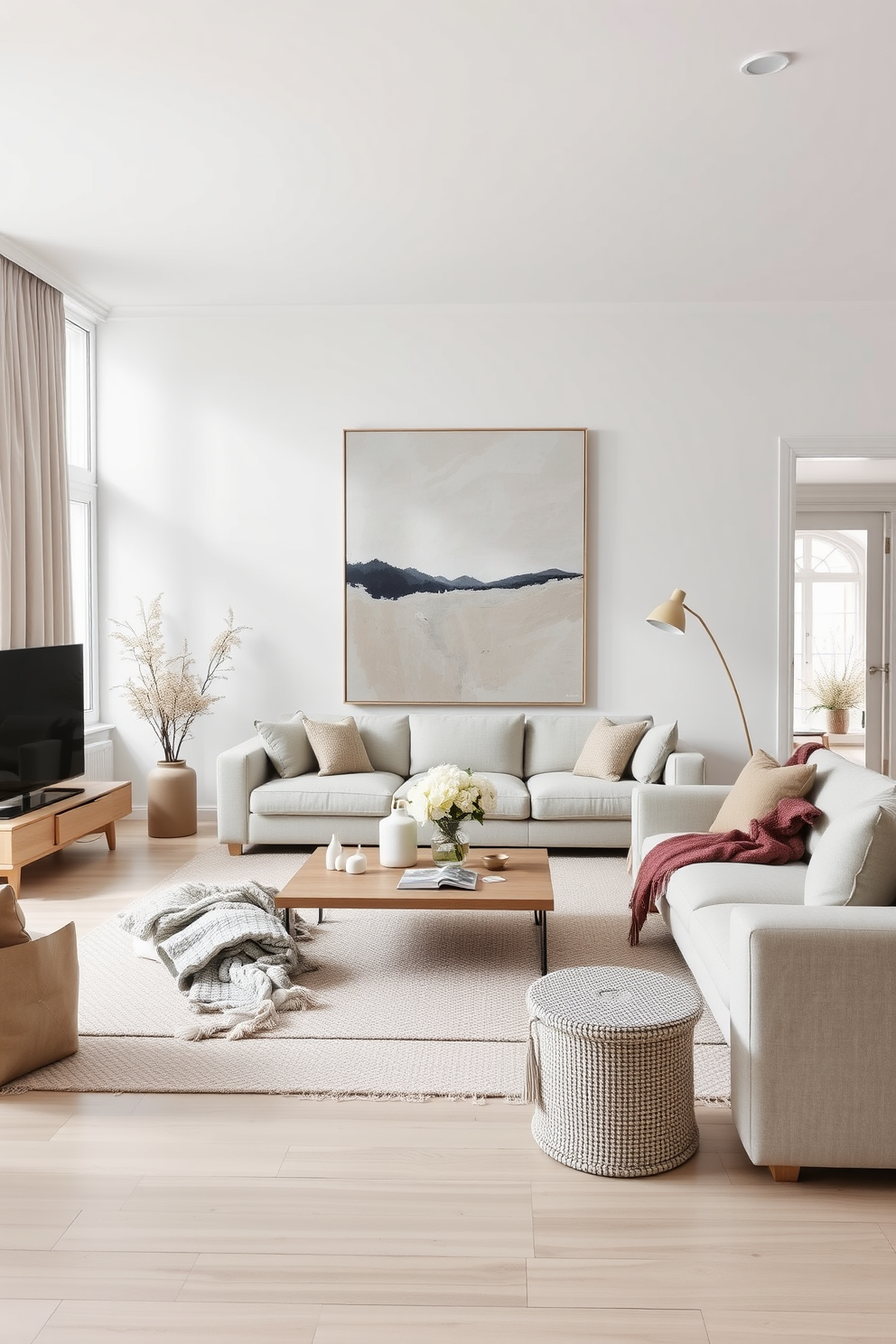 A modern Scandinavian living room featuring a neutral color palette with soft textures and natural light. The space includes a large abstract art piece on the main wall, complemented by minimalist furniture and cozy textiles.