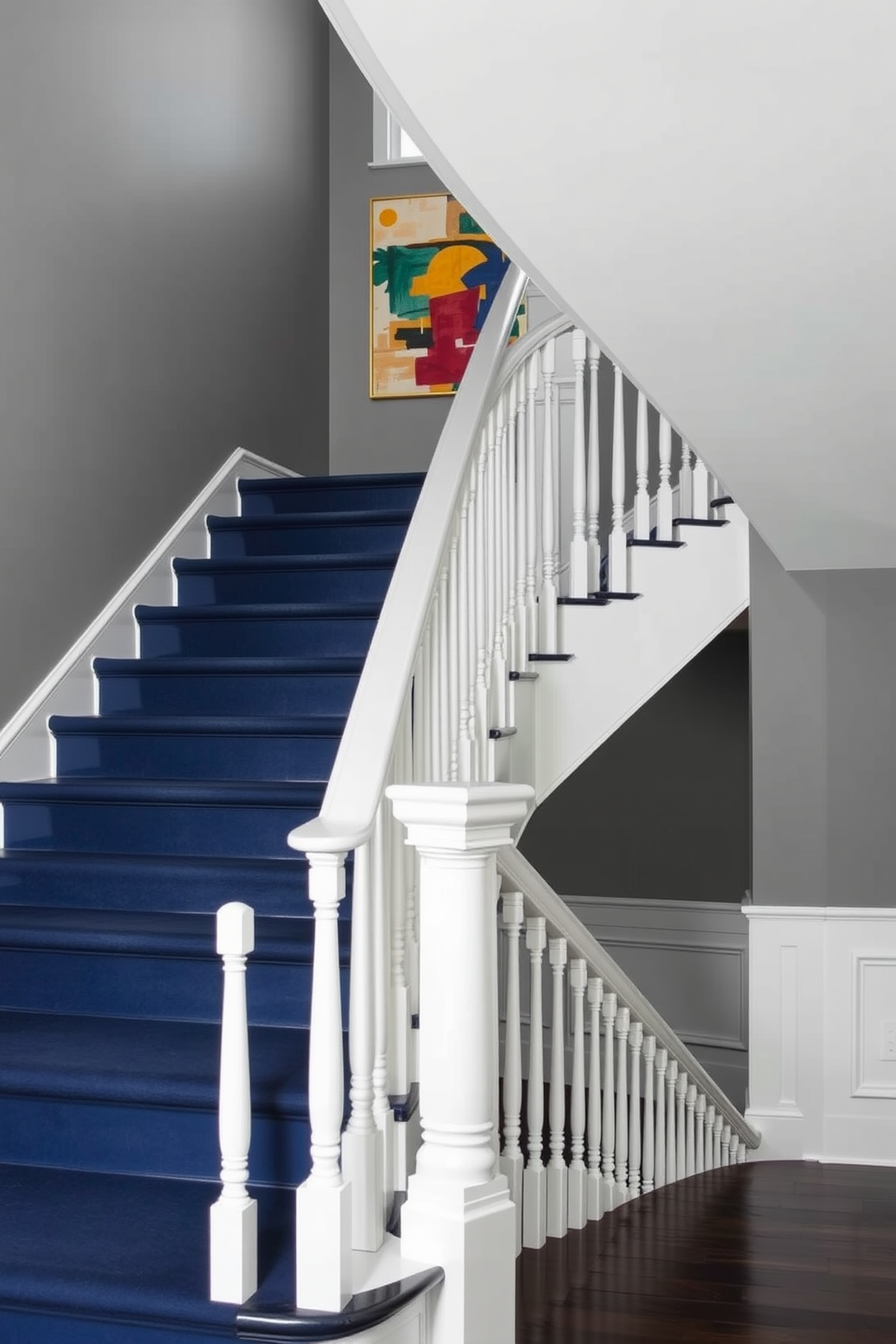 Classic staircase with carved newel posts. The balustrade features intricate woodwork that adds elegance to the space. The steps are covered in a plush runner, providing comfort and style. Natural light floods the area from a nearby window, highlighting the craftsmanship of the staircase. Second floor staircase design ideas. Incorporate a statement chandelier that draws the eye upwards and enhances the overall aesthetic. Consider using a two-tone color scheme for the walls and trim to create a striking visual contrast. Decorative wall panels can add depth and character to the staircase area.