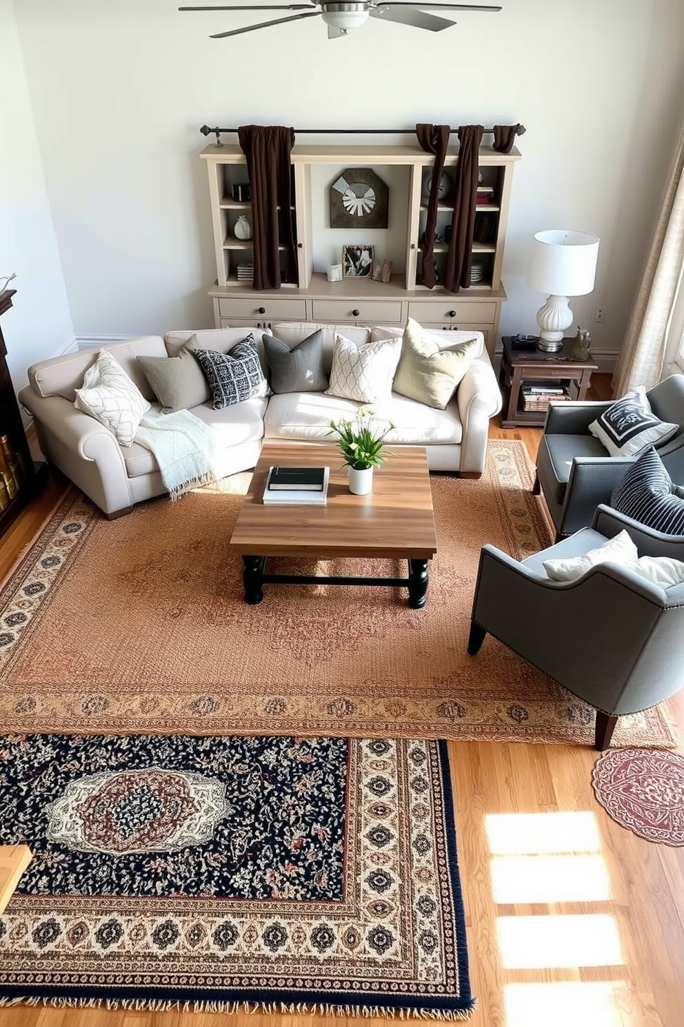 Layered rugs in a simple family room create a cozy atmosphere with rich textures. A large neutral area rug serves as the base, topped with smaller, patterned rugs to add visual interest and warmth. The family room features a comfortable sectional sofa with soft throw pillows, inviting relaxation and conversation. A wooden coffee table sits at the center, surrounded by a few stylish accent chairs to complete the inviting layout.