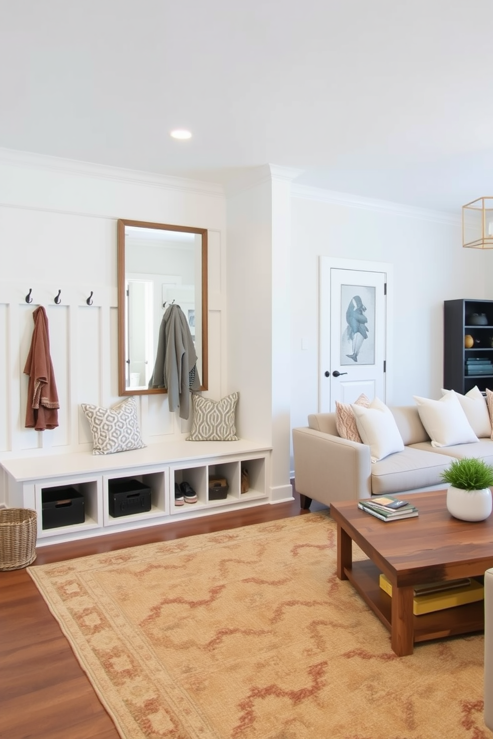 A functional entryway featuring built-in storage solutions such as a bench with cubbies and hooks for coats. The walls are painted in a light neutral color and a large mirror hangs above the bench to enhance the sense of space. A simple family room design with a cozy sectional sofa and a large area rug to define the seating area. The room is accented with soft throw pillows and a coffee table made of reclaimed wood, creating a warm and inviting atmosphere.