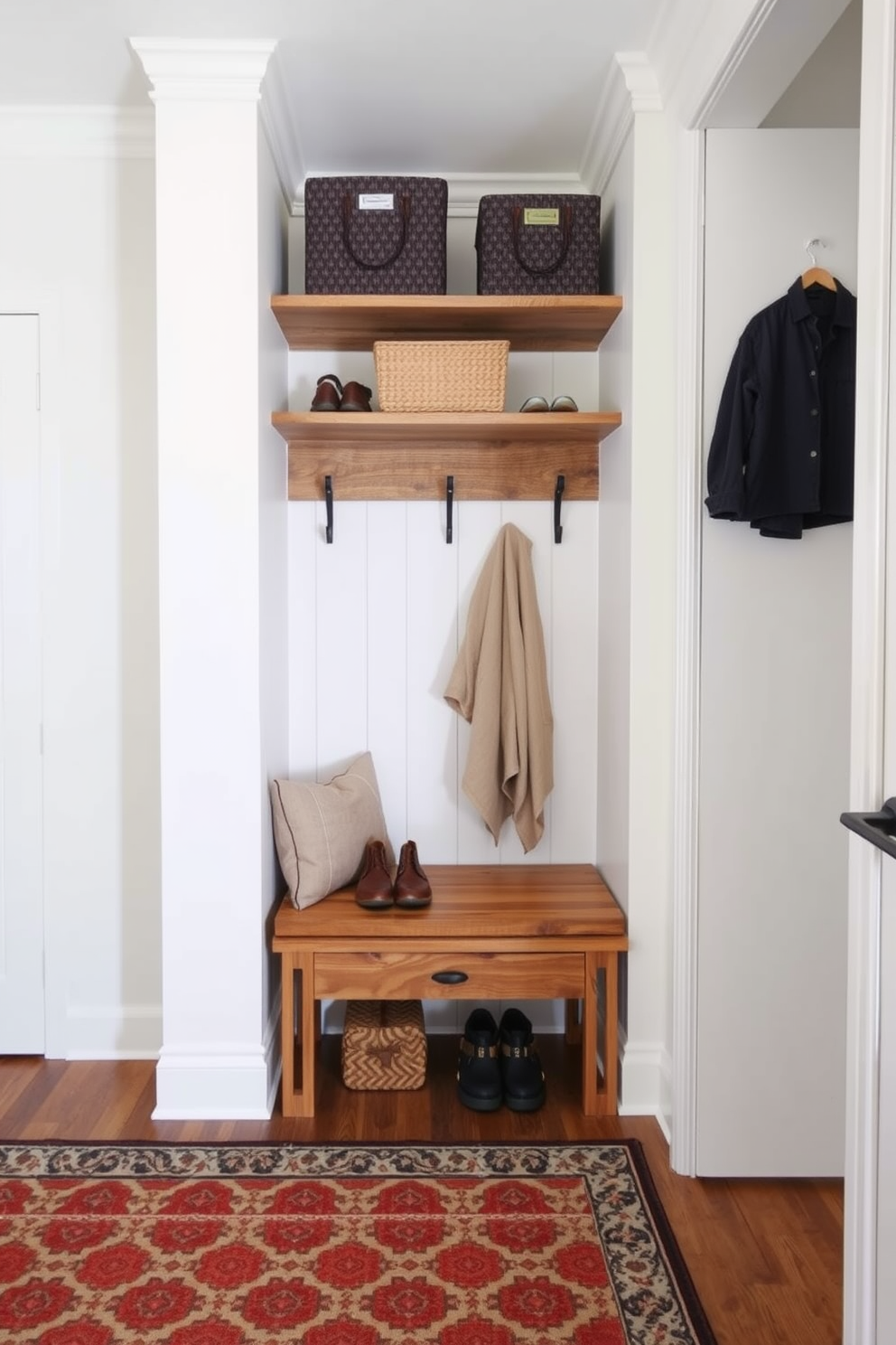 Open shelving made of reclaimed wood is installed along one wall, providing easy access to shoes and outdoor gear. A bench with soft cushions is positioned below the shelves, creating a welcoming spot for putting on or taking off shoes. The walls are painted in a light, airy color to enhance the spacious feel of the mudroom. A durable, patterned rug is placed on the floor to add warmth and style while being easy to clean.