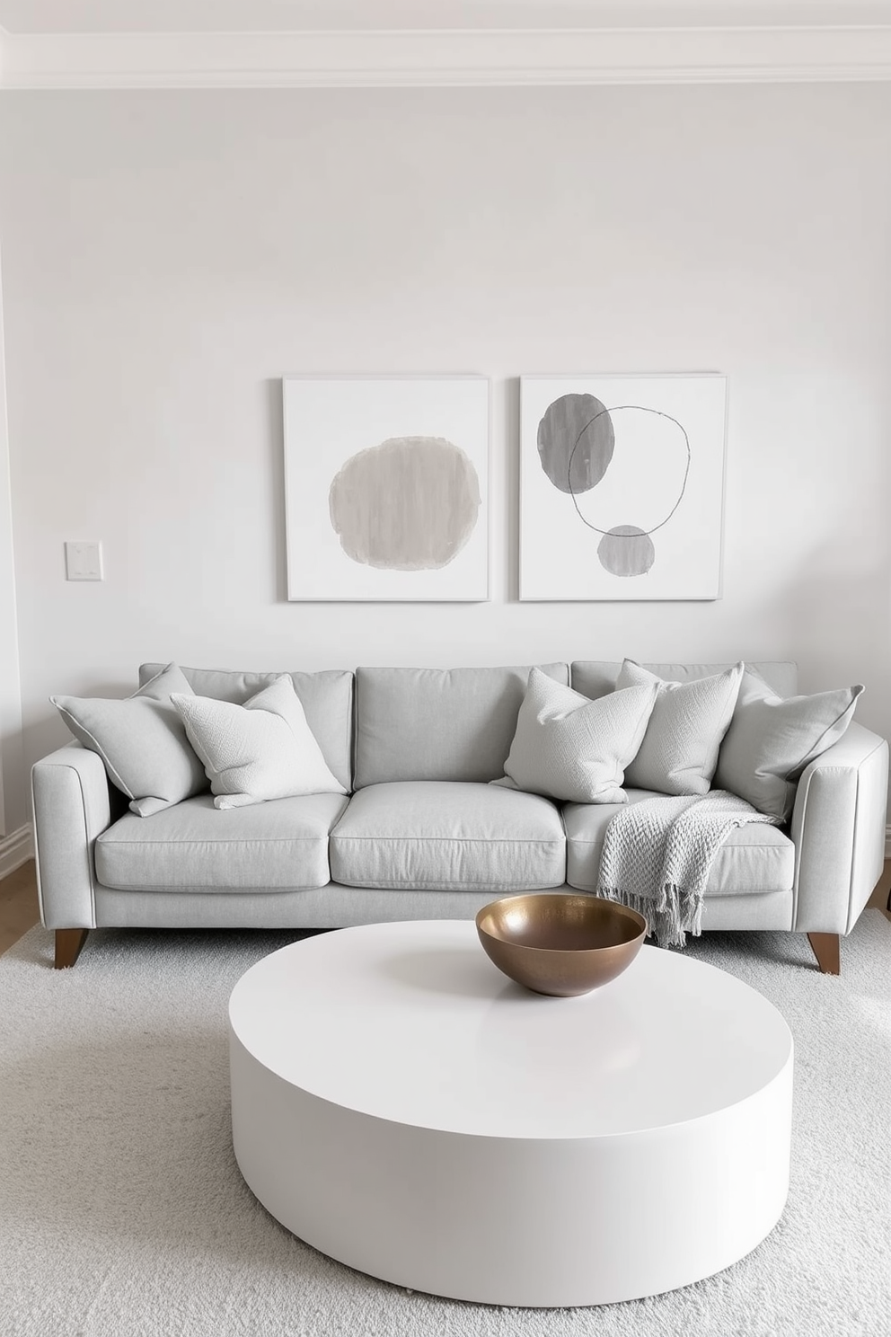 A living room featuring a monochromatic color scheme that exudes elegance. Soft shades of gray dominate the space, with a plush gray sofa adorned with textured pillows and a sleek coffee table in a matching hue. The walls are painted in a subtle light gray, enhancing the room's spacious feel. Simple wall painting designs, such as abstract shapes in darker gray tones, add visual interest without overwhelming the decor.