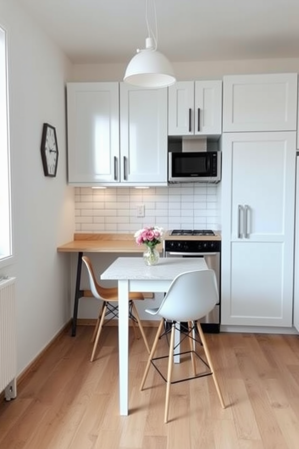 A small apartment kitchen with light-colored cabinetry and a white subway tile backsplash creates a bright and airy atmosphere. A compact island with bar stools provides additional seating and workspace, while large windows allow natural light to flood the space.