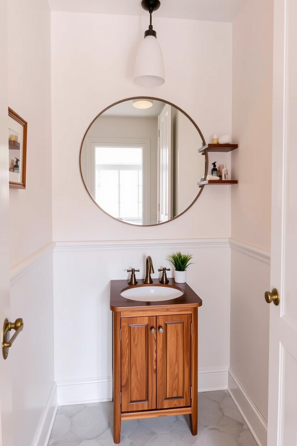 A cozy small bathroom featuring a round mirror that adds a soft touch to the space. The walls are painted in a light pastel color, and the floor is adorned with subtle geometric tiles. A compact wooden vanity with a sleek sink sits beneath the mirror, complemented by stylish brass fixtures. Shelves above the vanity hold neatly arranged toiletries and decorative items, enhancing the overall aesthetic.