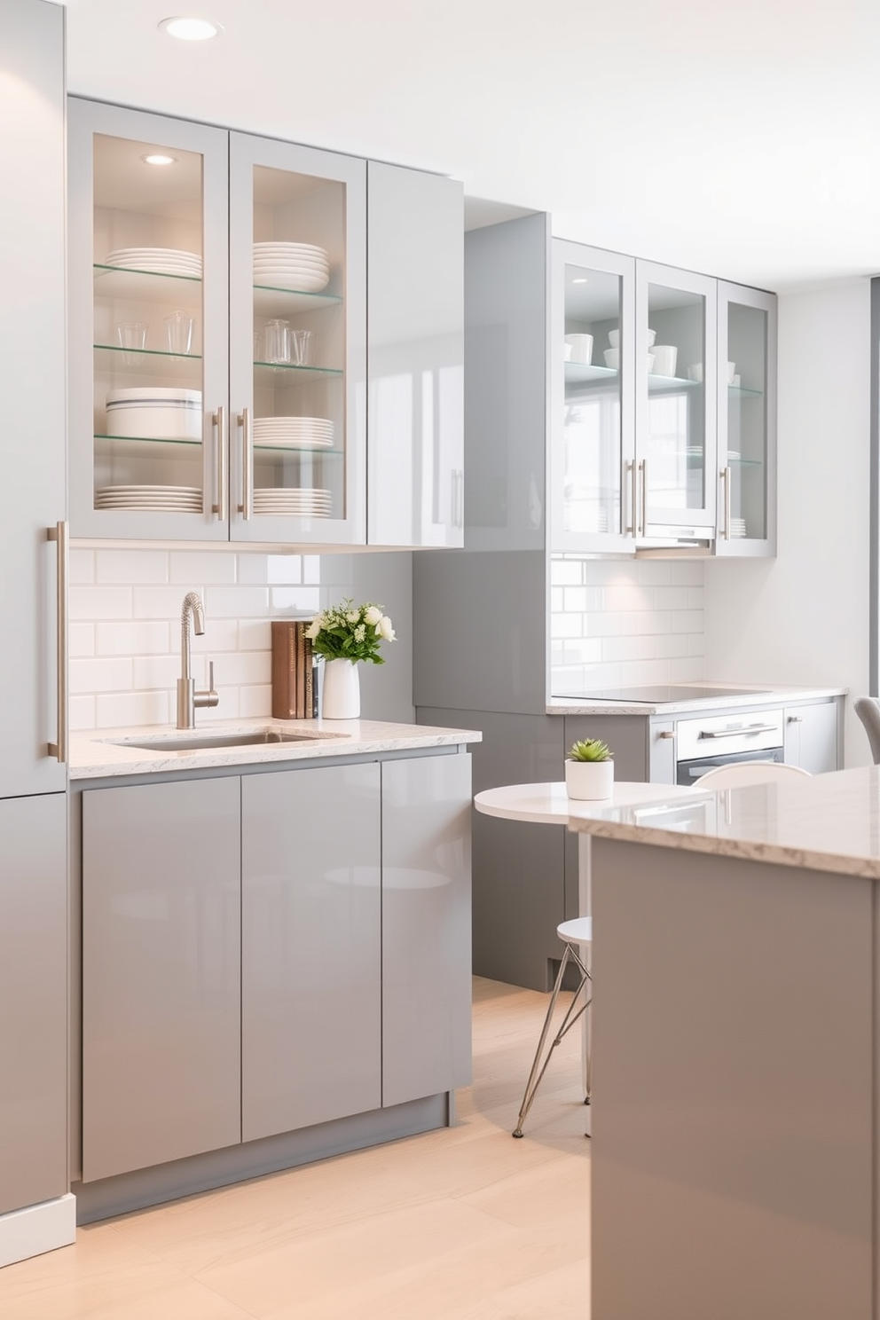 A modern condo kitchen featuring sleek cabinetry with glass cabinet doors for visibility, allowing an elegant display of dishware and glassware. The countertop is a polished quartz with subtle veining, complemented by a stylish backsplash of white subway tiles. Incorporate a compact dining area with a round table and minimalist chairs, maximizing space while providing a cozy dining experience. The color palette consists of soft grays and whites, creating an airy and inviting atmosphere.