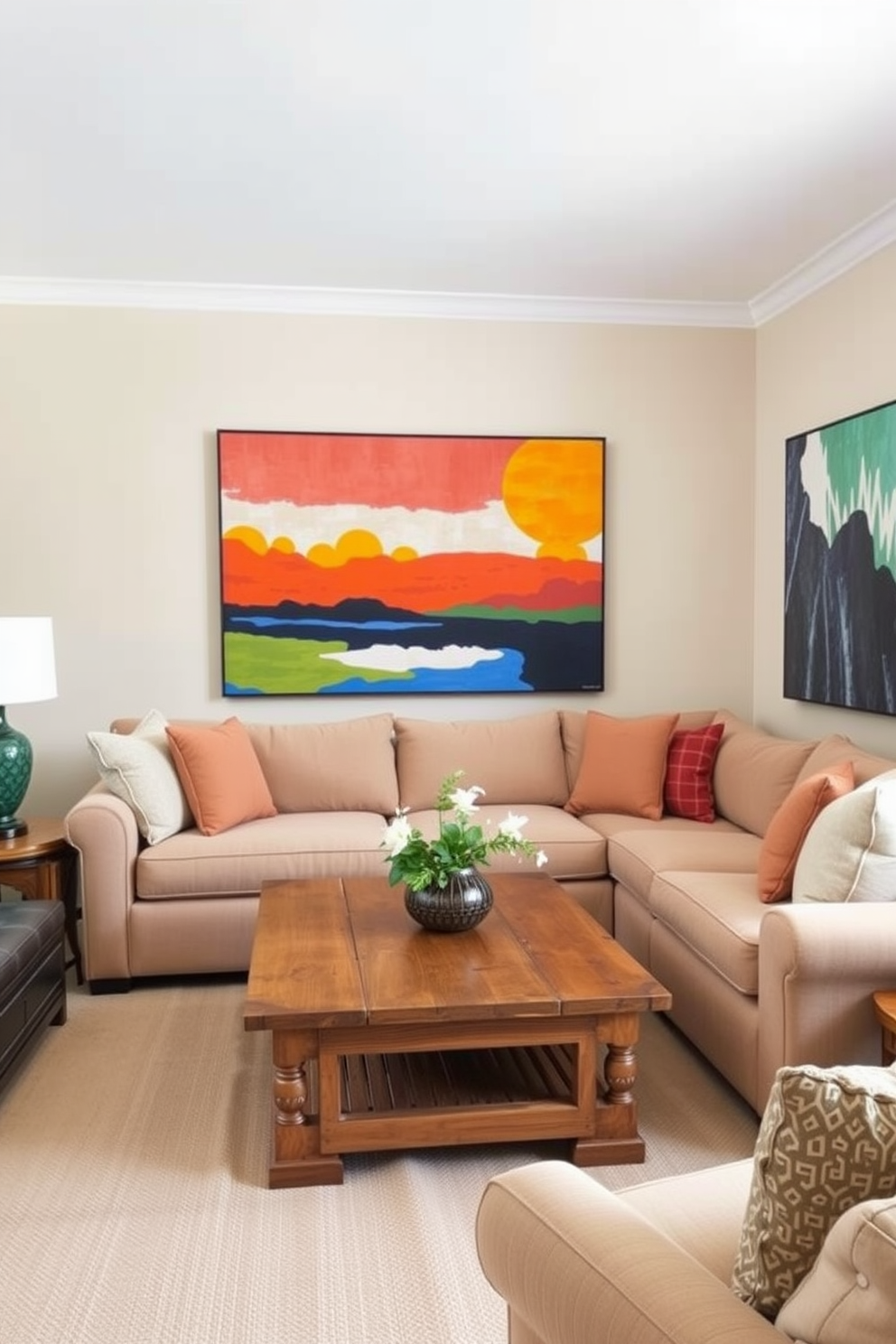 A small family room featuring bold artwork as a focal point. The walls are painted in a soft beige tone, allowing the vibrant colors of the artwork to stand out. A comfortable sectional sofa is arranged around a rustic wooden coffee table. Plush throw pillows in coordinating colors add texture and warmth to the space.