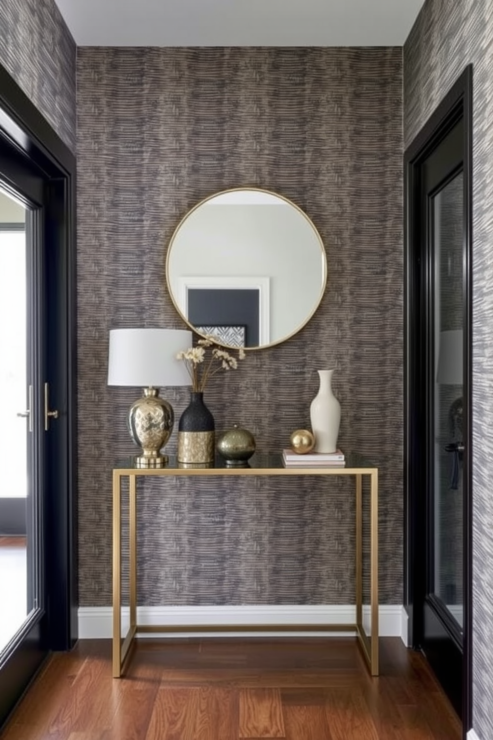 A stylish small foyer featuring textured wallpaper that adds depth and character to the space. The entrance includes a sleek console table with decorative items and a round mirror above it, creating an inviting atmosphere.