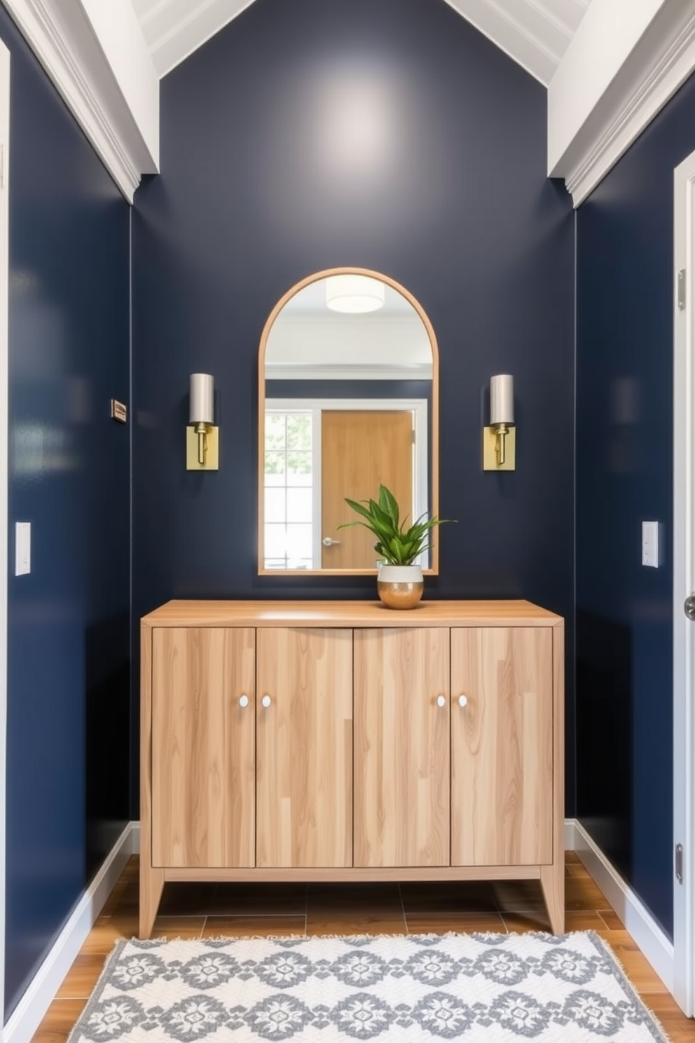 A small foyer featuring a neutral color palette that promotes a calming atmosphere. The walls are painted in a soft beige, with a sleek console table against one side adorned with a simple decorative bowl. A round mirror hangs above the console, reflecting natural light from a nearby window. A cozy area rug in muted tones lies on the floor, inviting guests into the serene space.