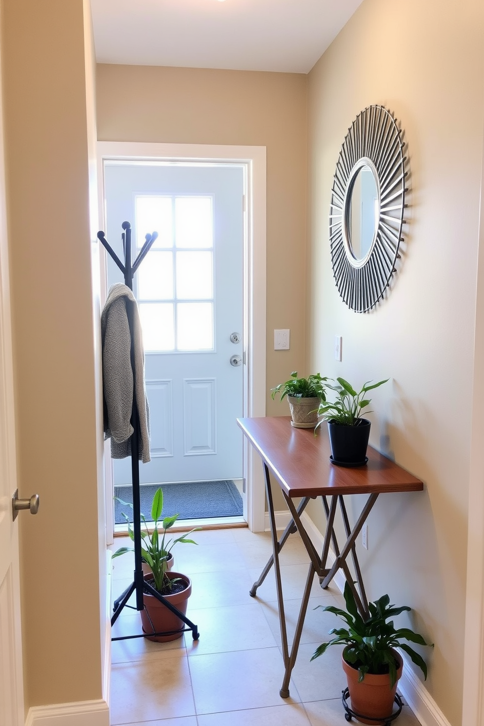 A small foyer with a folding table that can be easily tucked away when not in use. The walls are painted in a soft beige tone, and a stylish coat rack stands beside the entrance. A decorative mirror hangs above the folding table, reflecting natural light from a nearby window. Potted plants are placed on the floor, adding a touch of greenery and warmth to the space.