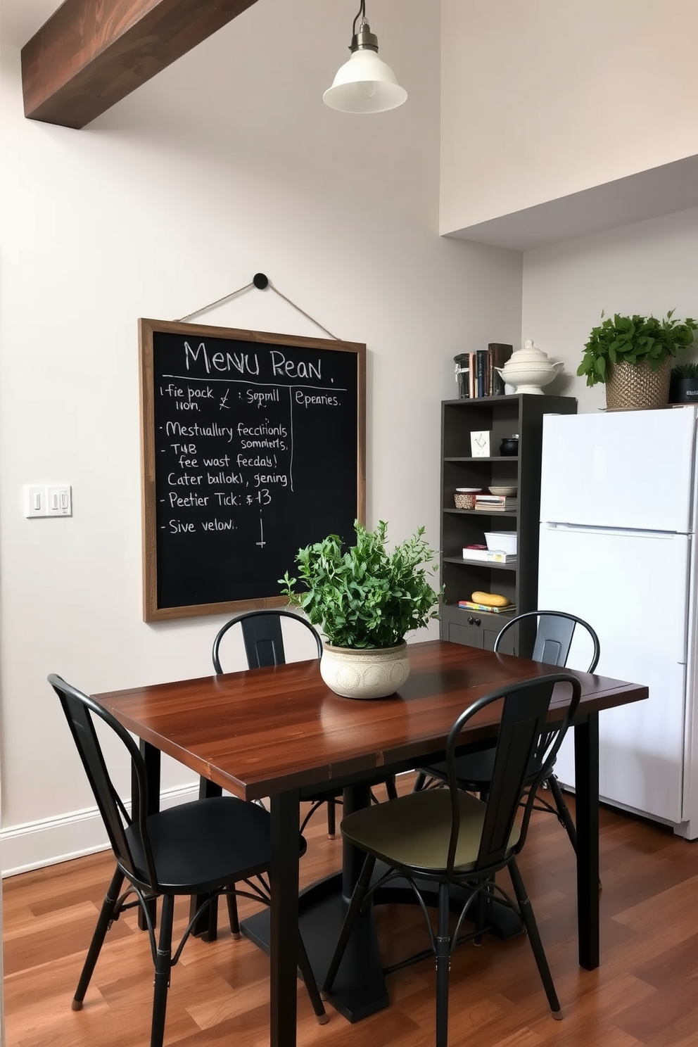 A cozy small kitchen dining room features a chalkboard mounted on the wall for menu planning. The dining table is surrounded by four stylish chairs, with a centerpiece of fresh herbs in a rustic pot.