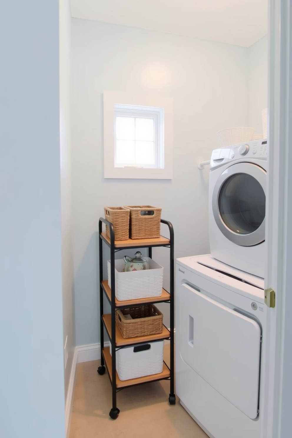 A small laundry room featuring a compact utility cart for supplies. The cart is made of metal with wooden shelves, positioned next to a stackable washer and dryer set. The walls are painted in a light blue hue, creating a calming atmosphere. A small window allows natural light to brighten the space, and decorative baskets are neatly arranged on the shelves of the cart.