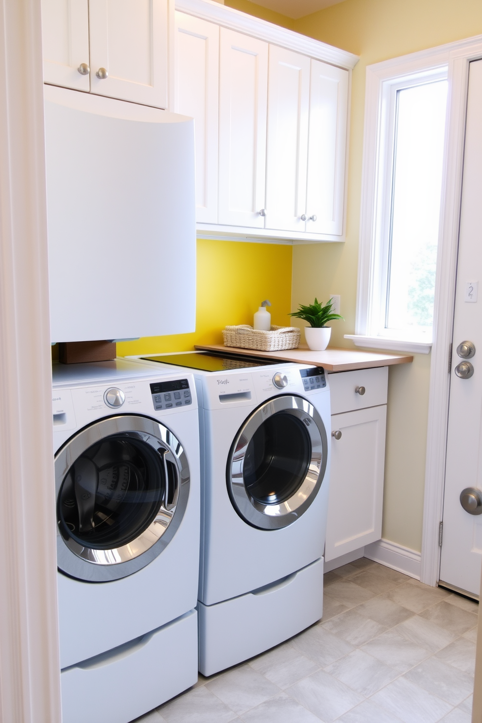 A small laundry room features stackable washer and dryer units neatly tucked into a corner. The space is brightened by white cabinets above the appliances and a cheerful yellow backsplash that adds a pop of color. A folding countertop extends from the cabinetry, providing a convenient space for sorting and folding laundry. The floor is adorned with light gray tiles that create a clean and modern look, while a small potted plant adds a touch of freshness to the room.