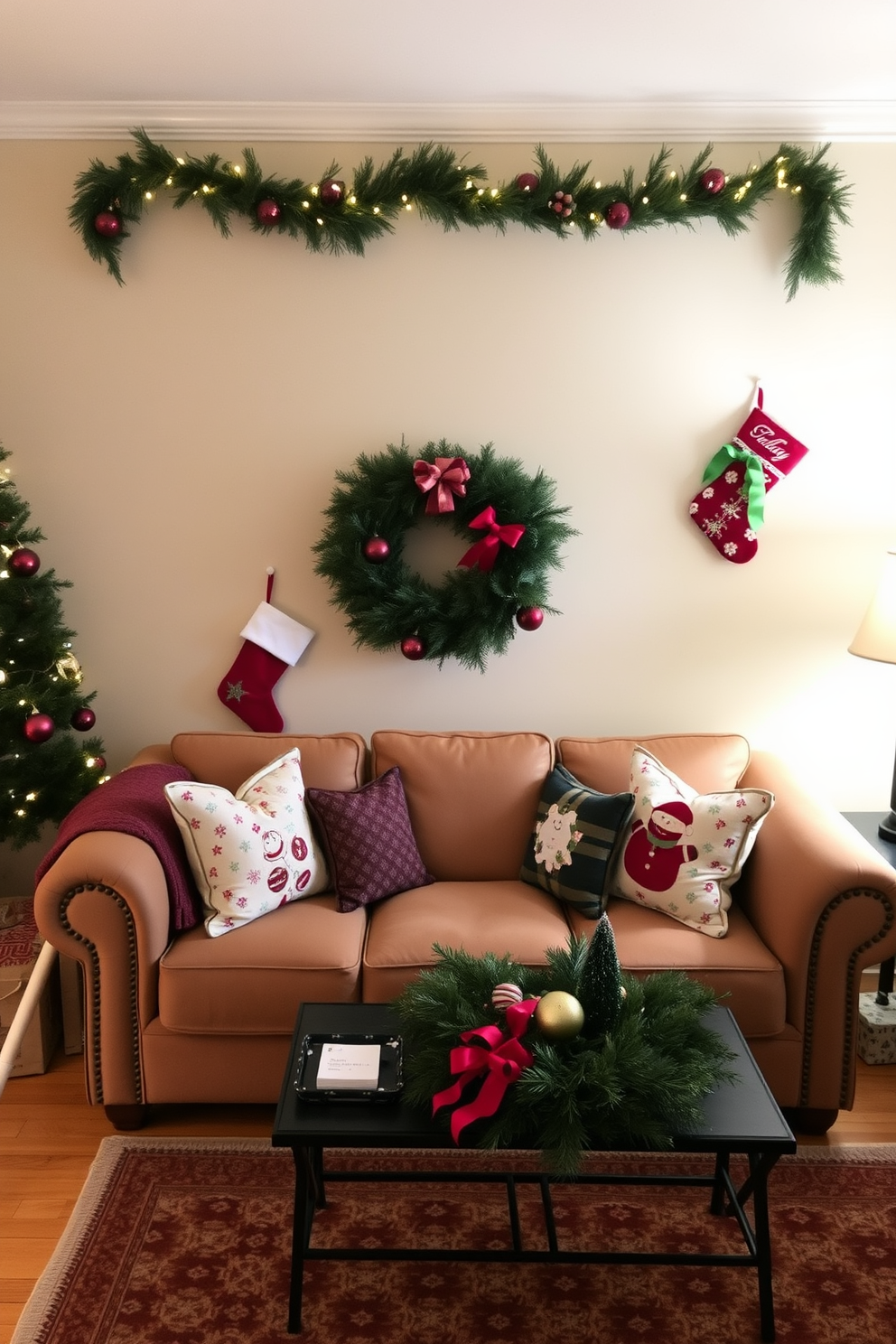 A cozy living room adorned for Christmas features a plush couch with a warm throw blanket draped over one arm. Above the couch, festive stockings in various colors and patterns are hung, creating a cheerful holiday atmosphere.