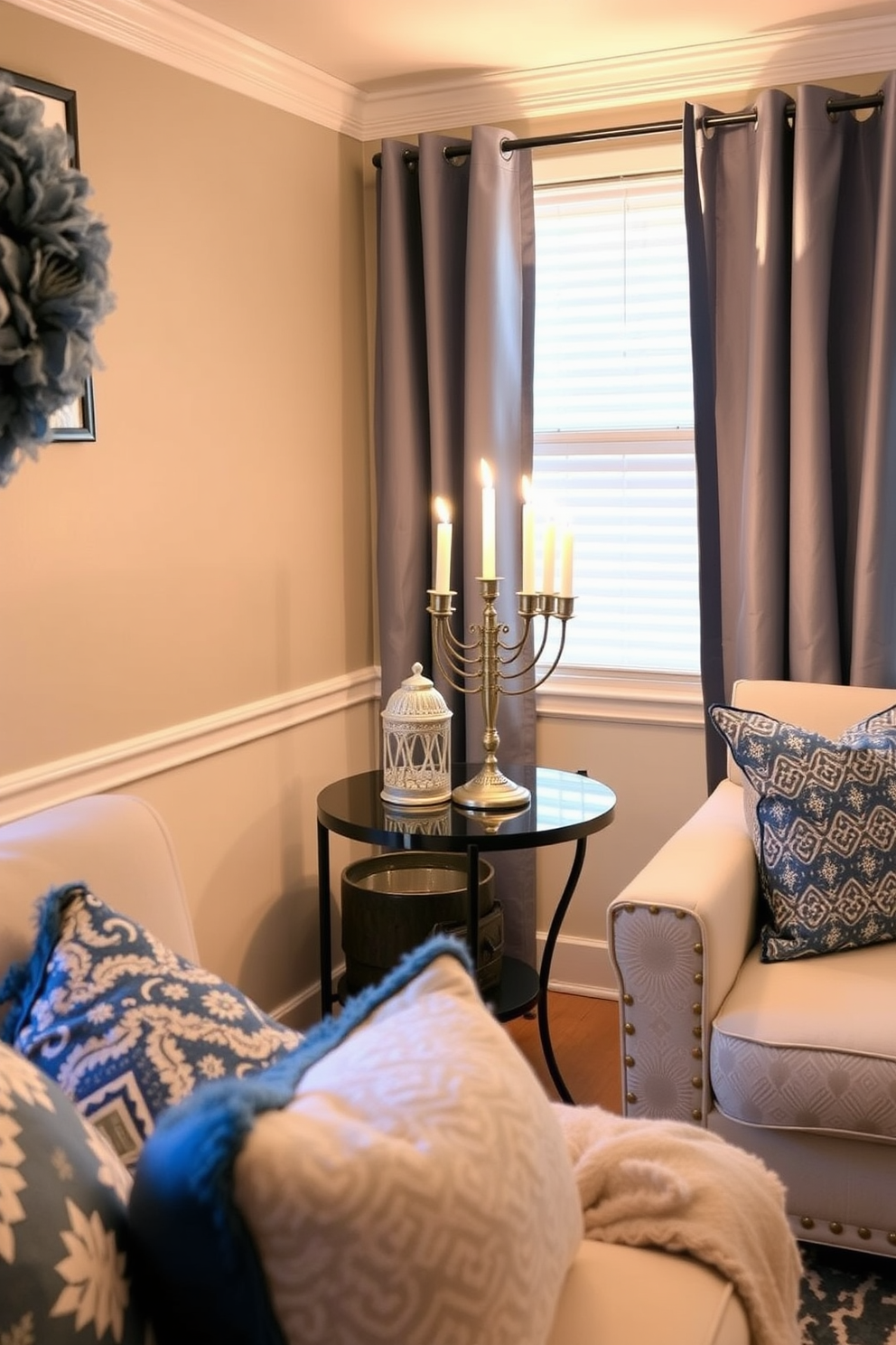 A cozy small living room adorned with winter greenery and Hanukkah accents. The space features a plush sofa draped with a blue and silver throw blanket, surrounded by potted evergreen plants and decorative menorahs.