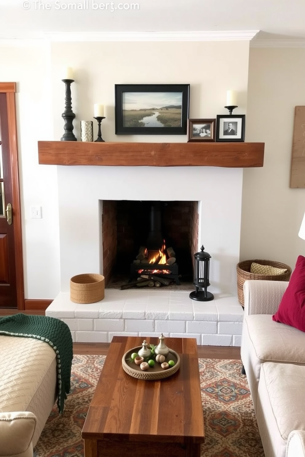 A rustic wood mantel is adorned with decorative accents such as candles and framed photos. The small living room features a cozy fireplace surrounded by comfortable seating and warm, inviting textiles.